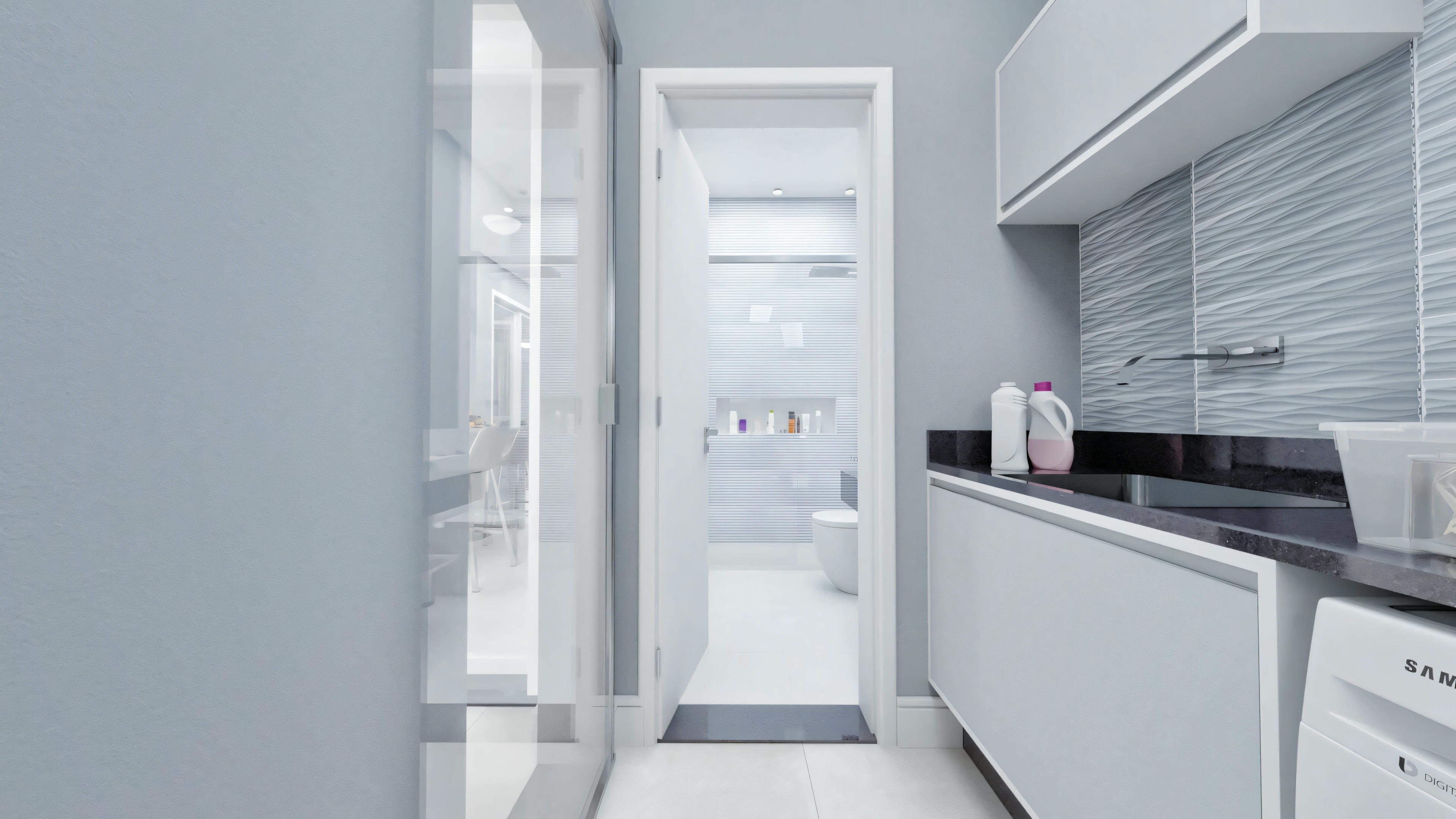 Una cocina moderna con gabinetes blancos, electrodomésticos de acero inoxidable y un espacio estrecho que conduce a otra habitación.
