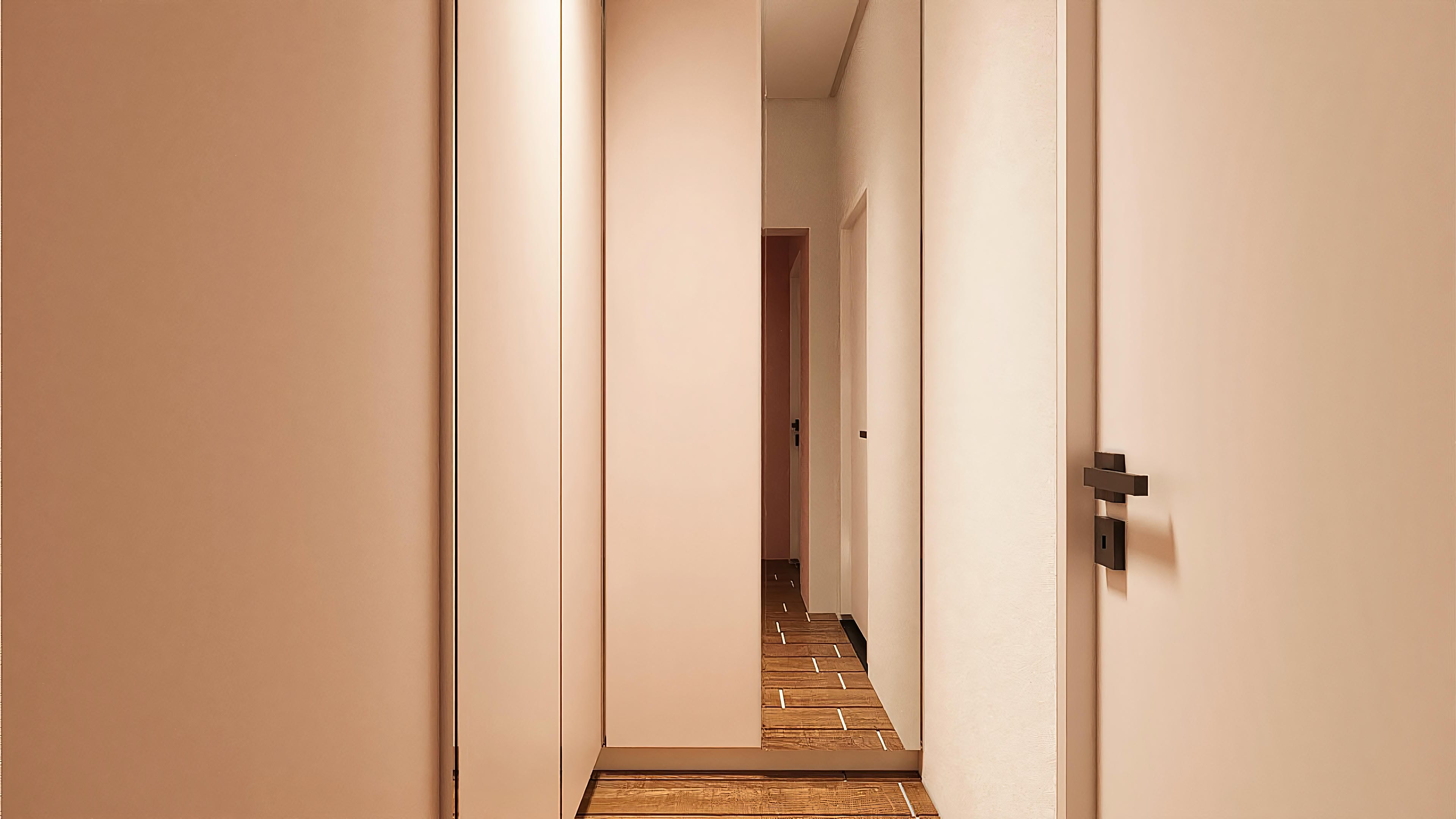 Interior of a neoclassical two-story house with a neutral hallway in beige tones, highlighting a wooden floor with recessed lighting and discreet doors.
