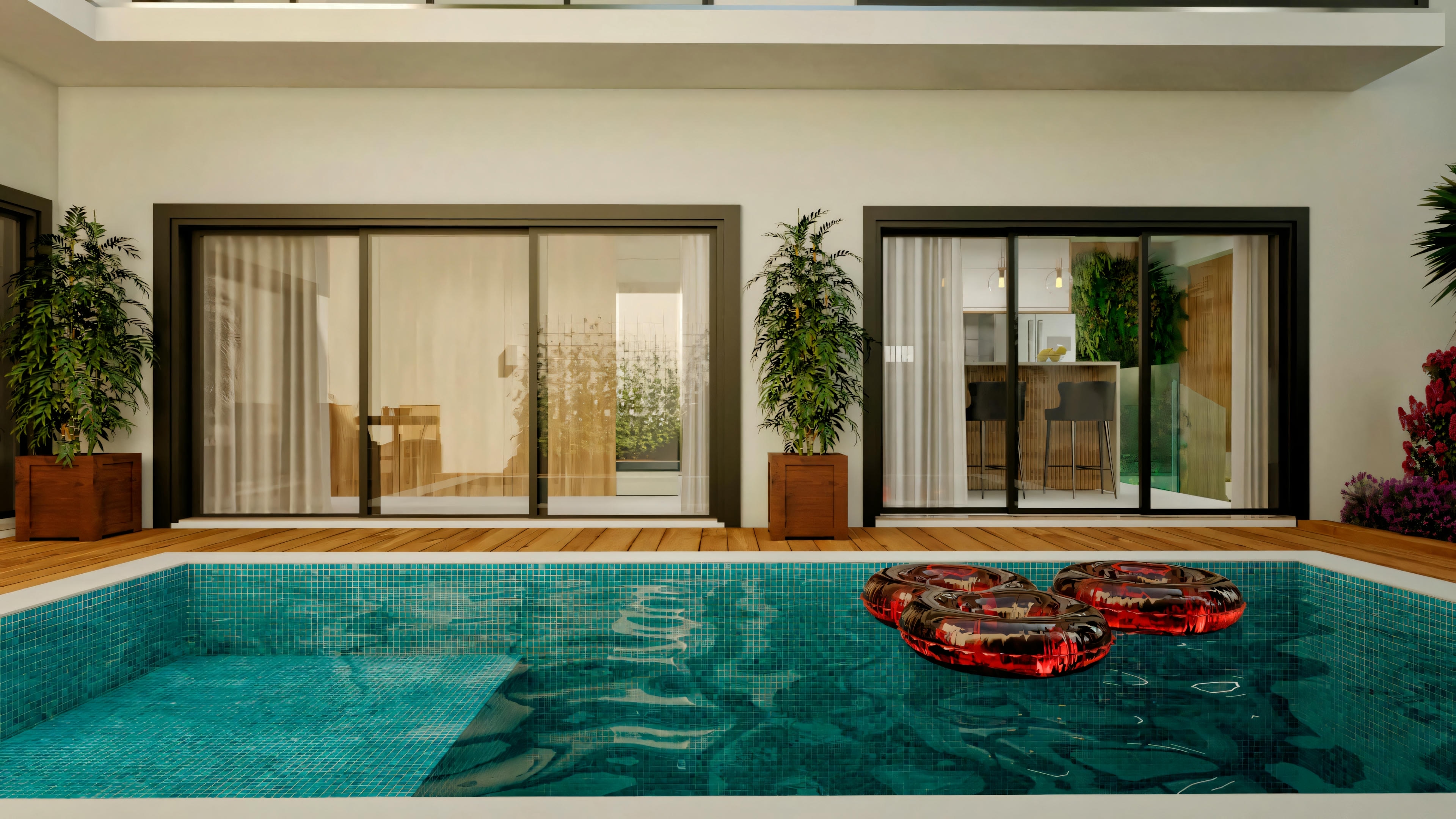 Uma piscina interna com um objeto inflável vermelho flutuando na água, grandes janelas e vista para uma sala adjacente.