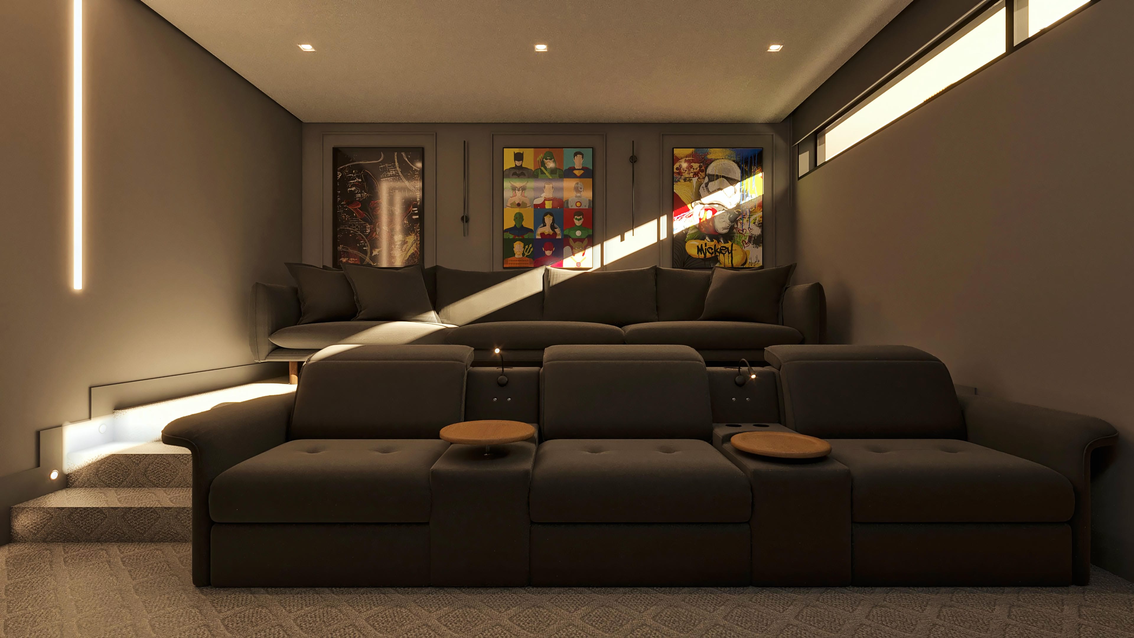 Sala de cine privada con sofás reclinables, iluminación moderna en LED y obras de arte vibrantes en las paredes, ideal para el entretenimiento de alto nivel.