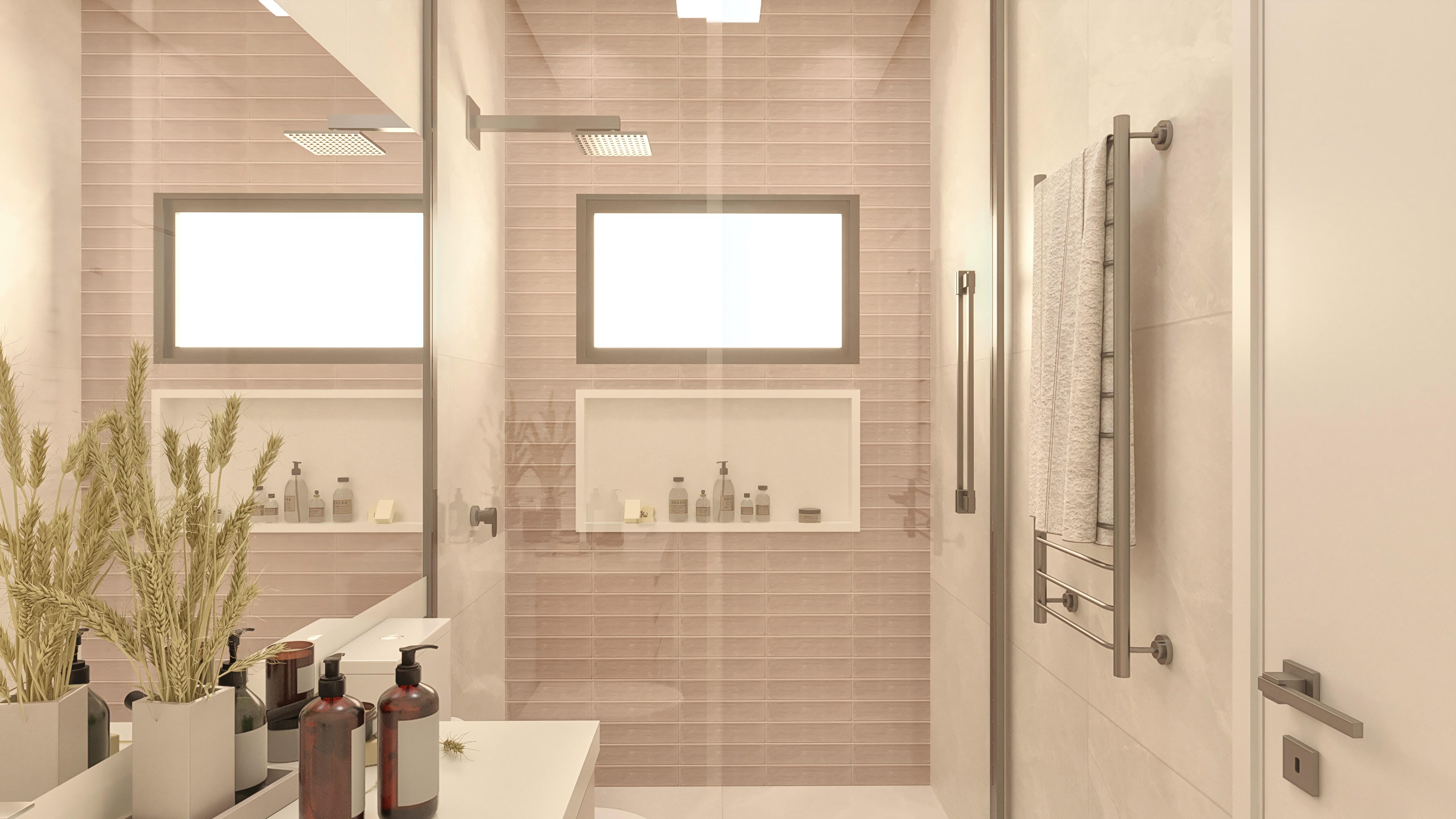 Interior de un baño moderno con azulejos en tonos pastel en la pared, amplio espejo y hornacina para organización. Destaca la ducha con diseño depurado y el calentador de toallas.
