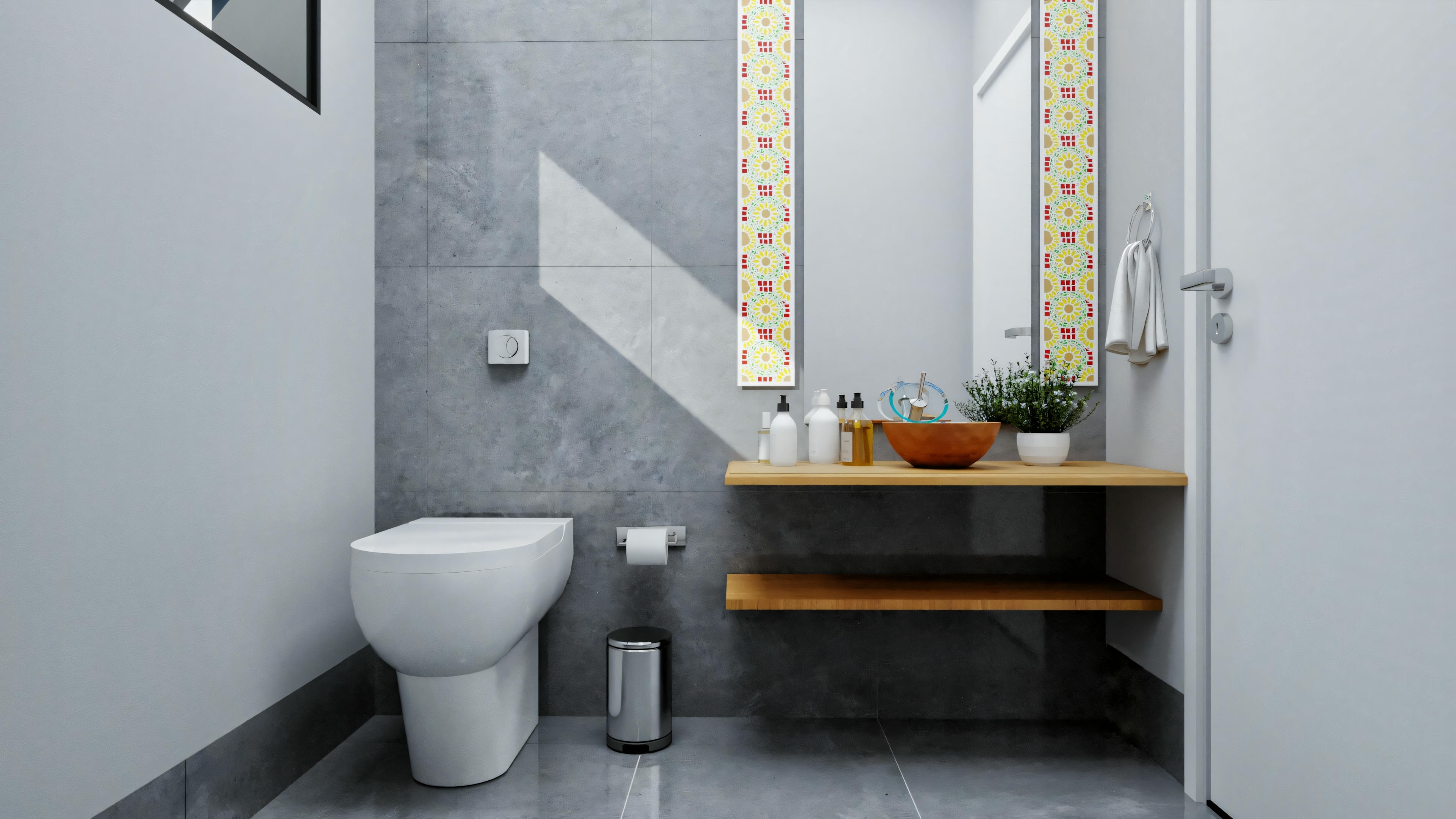 Bathroom with gray walls and yellow accents, toilet, and sink with an exposed wooden shelf.