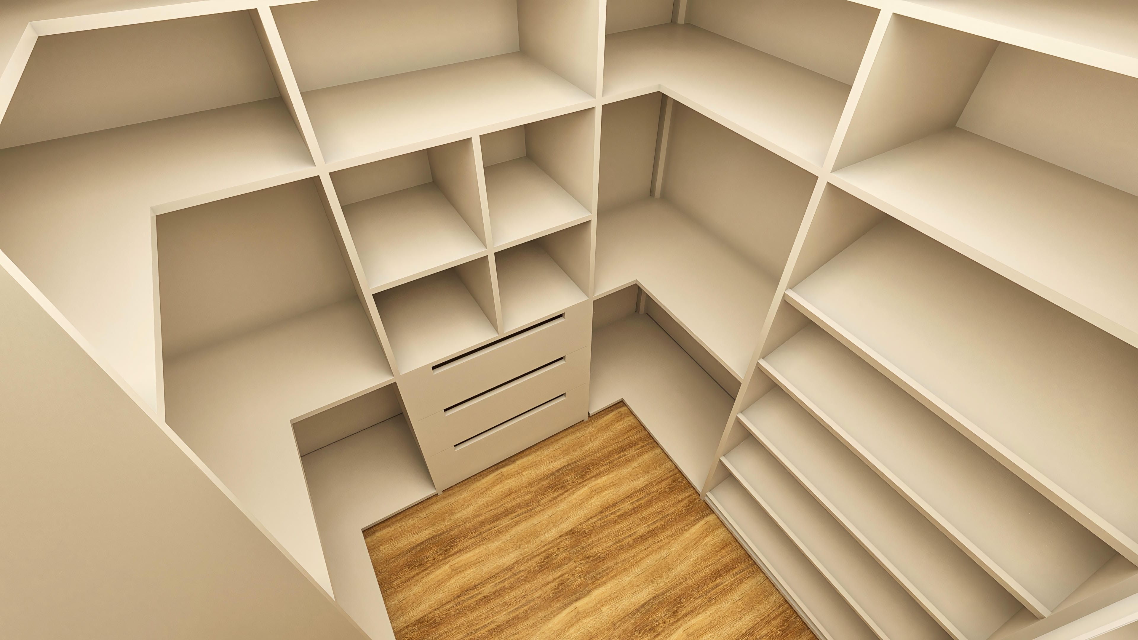 Interior de un vestidor con estantes abiertos y nichos en L, cajonera central con frentes lisos y suelo laminado en tono madera. Colores neutros y diseño funcional.
