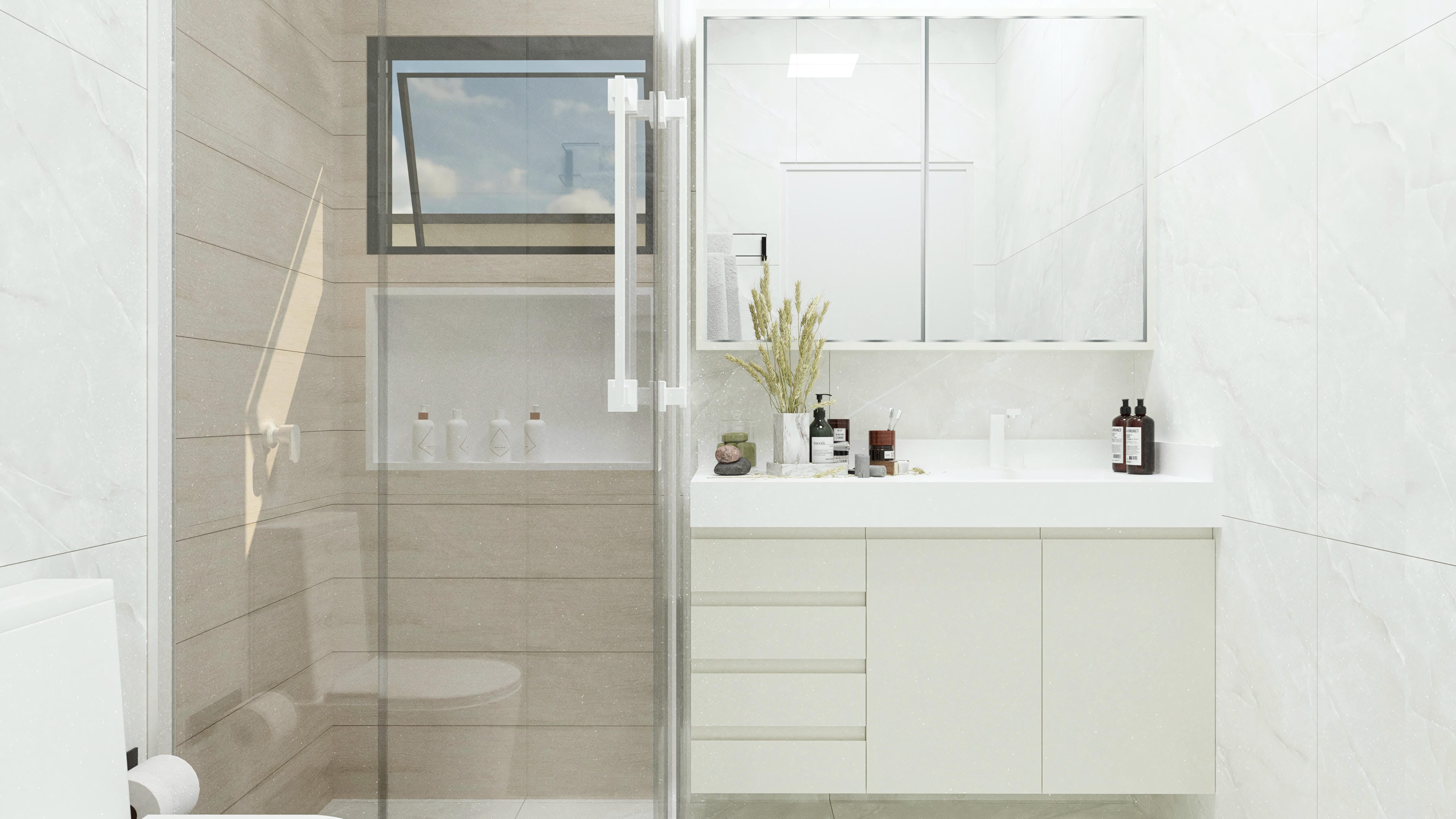 Interior de un baño moderno con revestimientos claros, encimera suspendida y zona de ducha con vidrio templado.