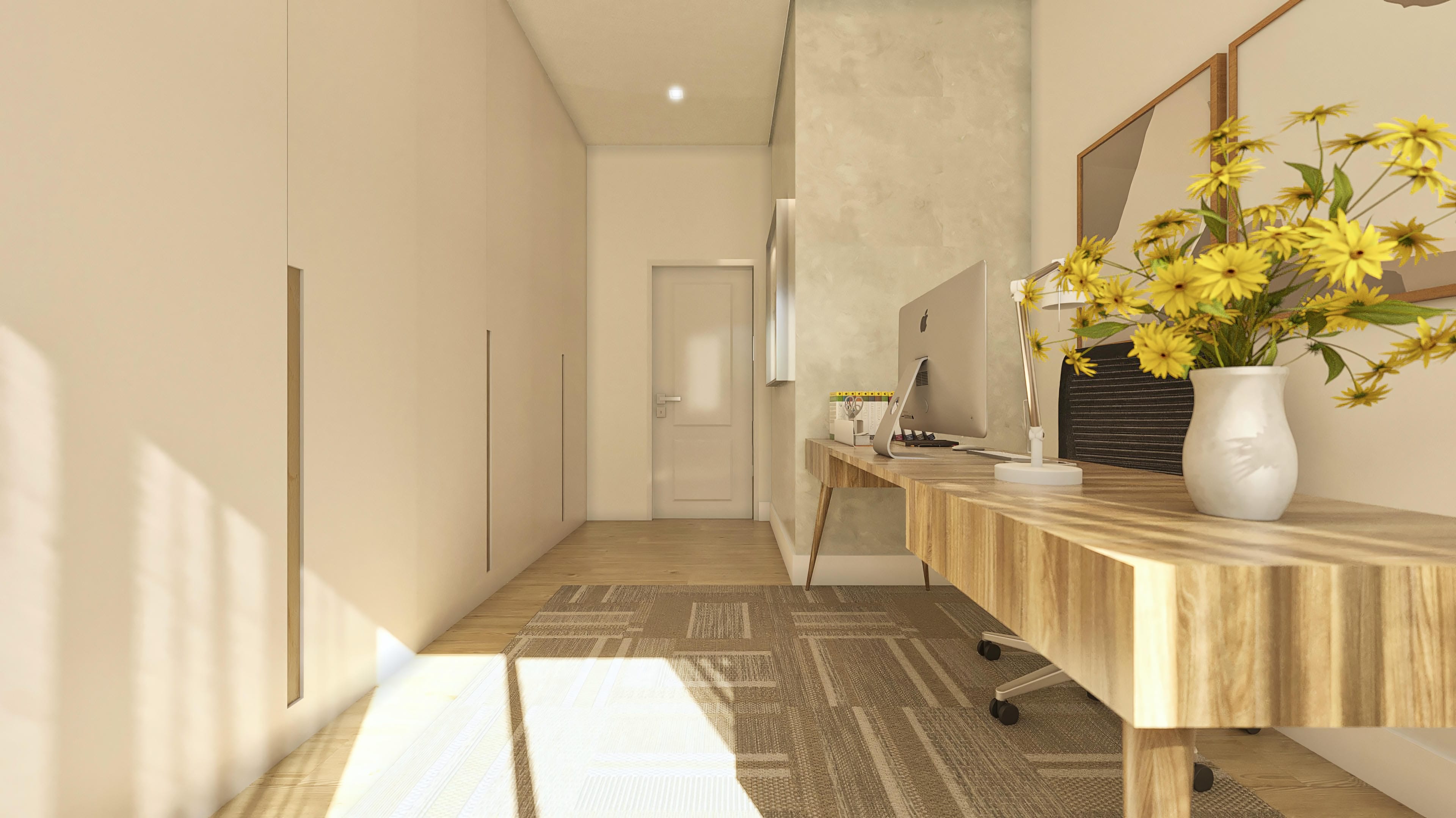Office environment with a light wood desk, computer, and yellow flower arrangement. Neutral-toned walls and natural lighting.