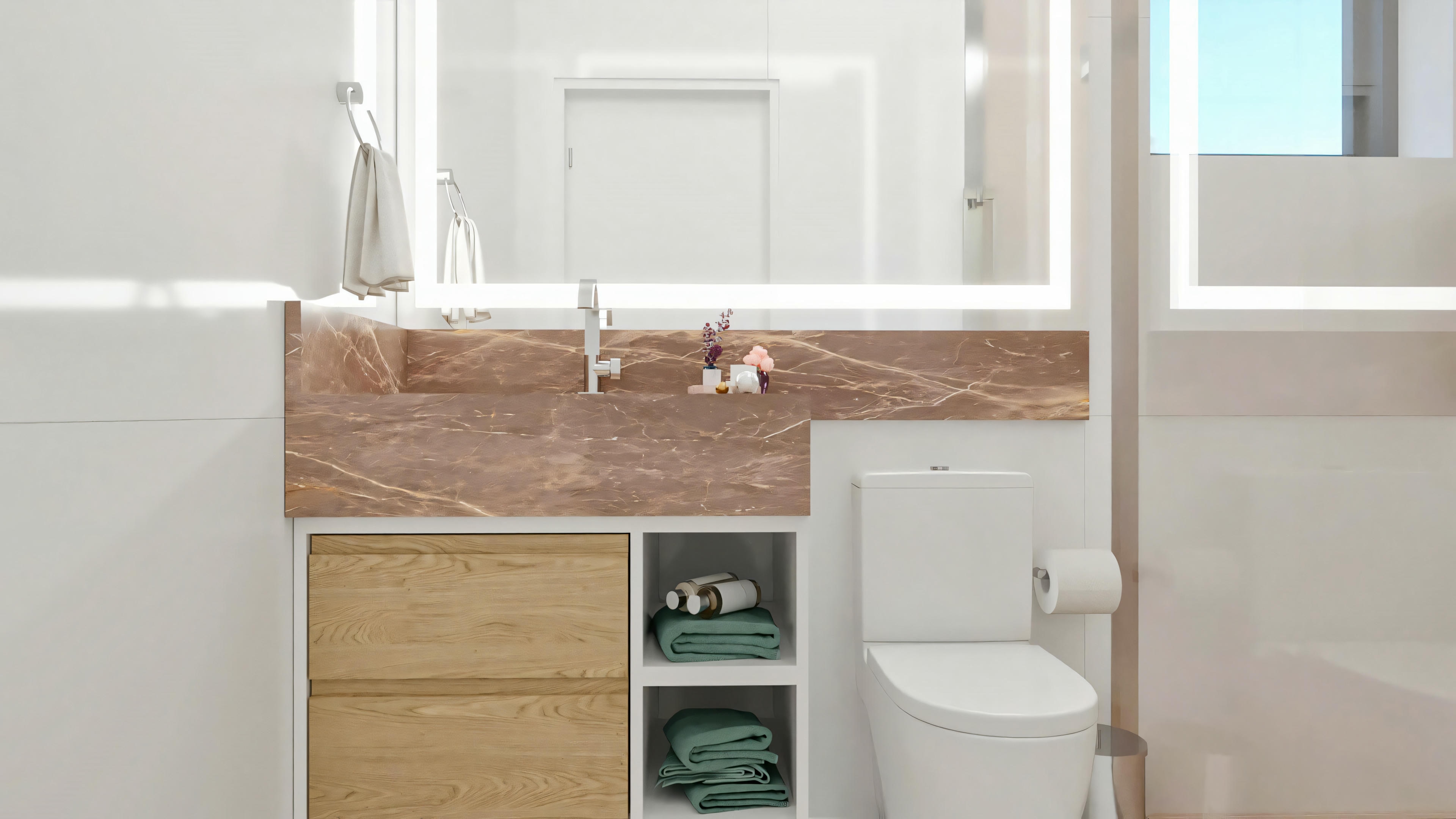Baño de una de las 5 suites del proyecto listo, con mesada y frente en mármol/piedra marrón, lavabo embutido, espejo grande con iluminación LED, armario inferior con nichos y cajones en madera clara.