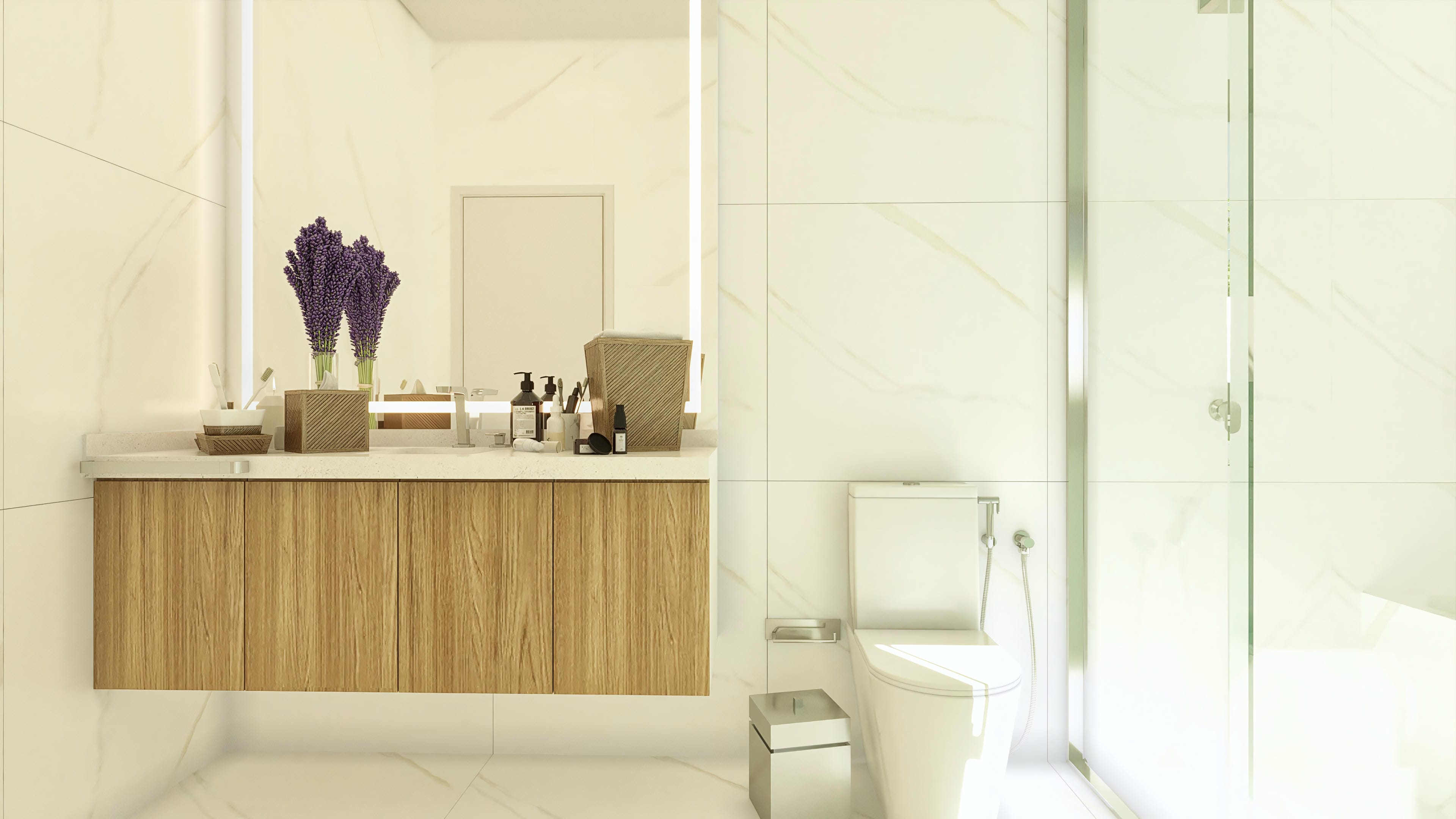 Details of a luxurious bathroom with a light wood cabinet, marble counter, and walls clad in large porcelain tiles that mimic marble. The integrated LED lighting in the mirror enhances sophistication.