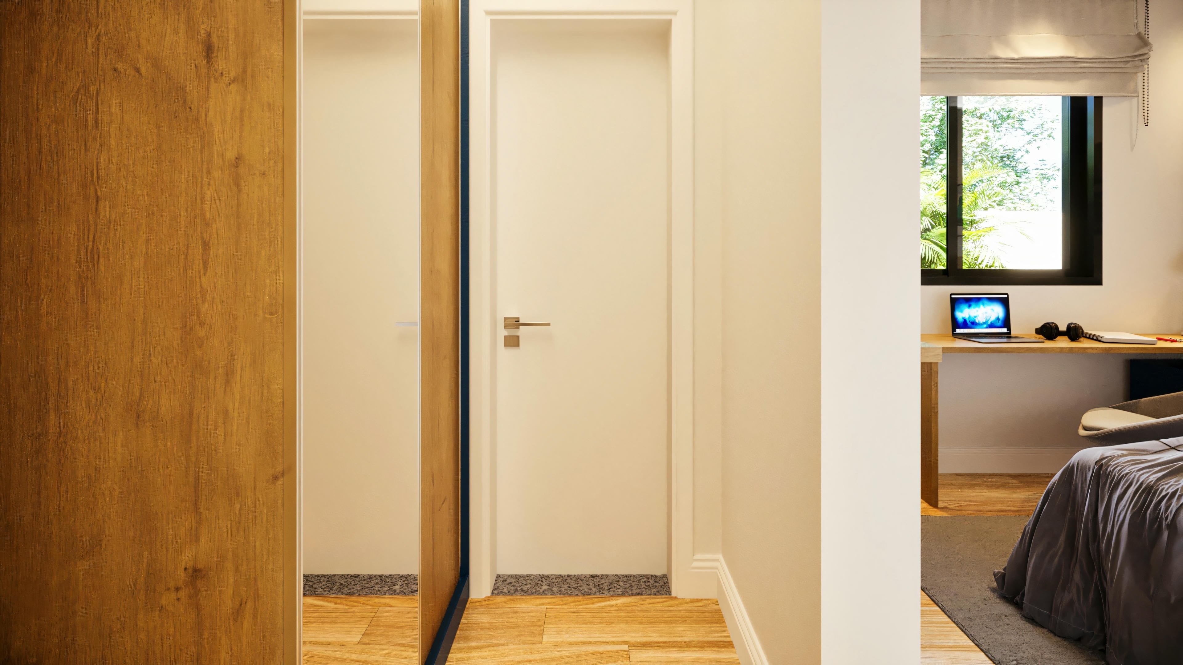 Internal hallway of a suite in a 3-suite single-story house, displaying a wooden wardrobe with a mirror, white access door, and partial view of the bedroom with a home office desk.