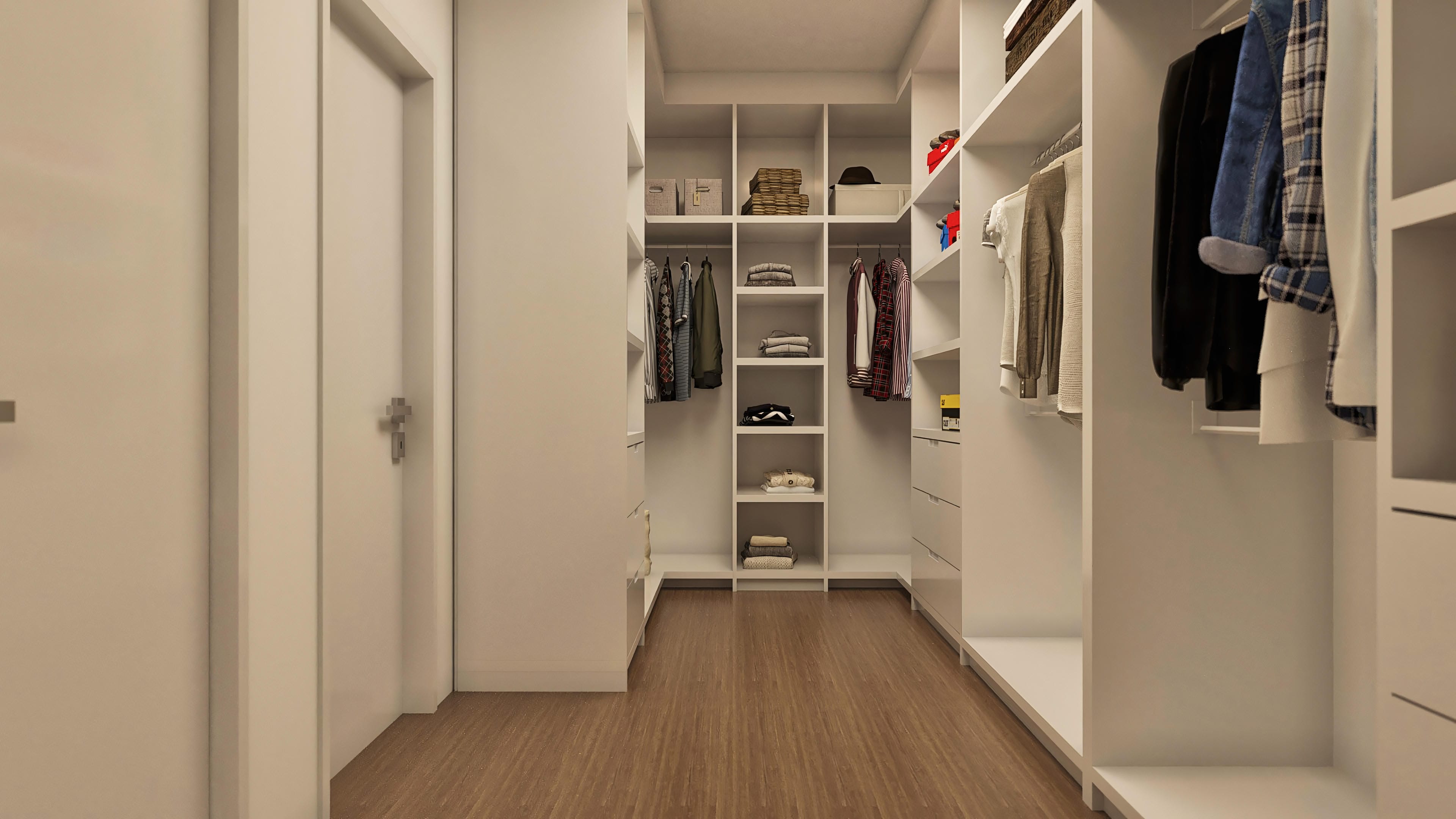 Interior de un vestidor espacioso y bien organizado con armarios blancos, estantes y percheros. El piso imita madera en tono oscuro.