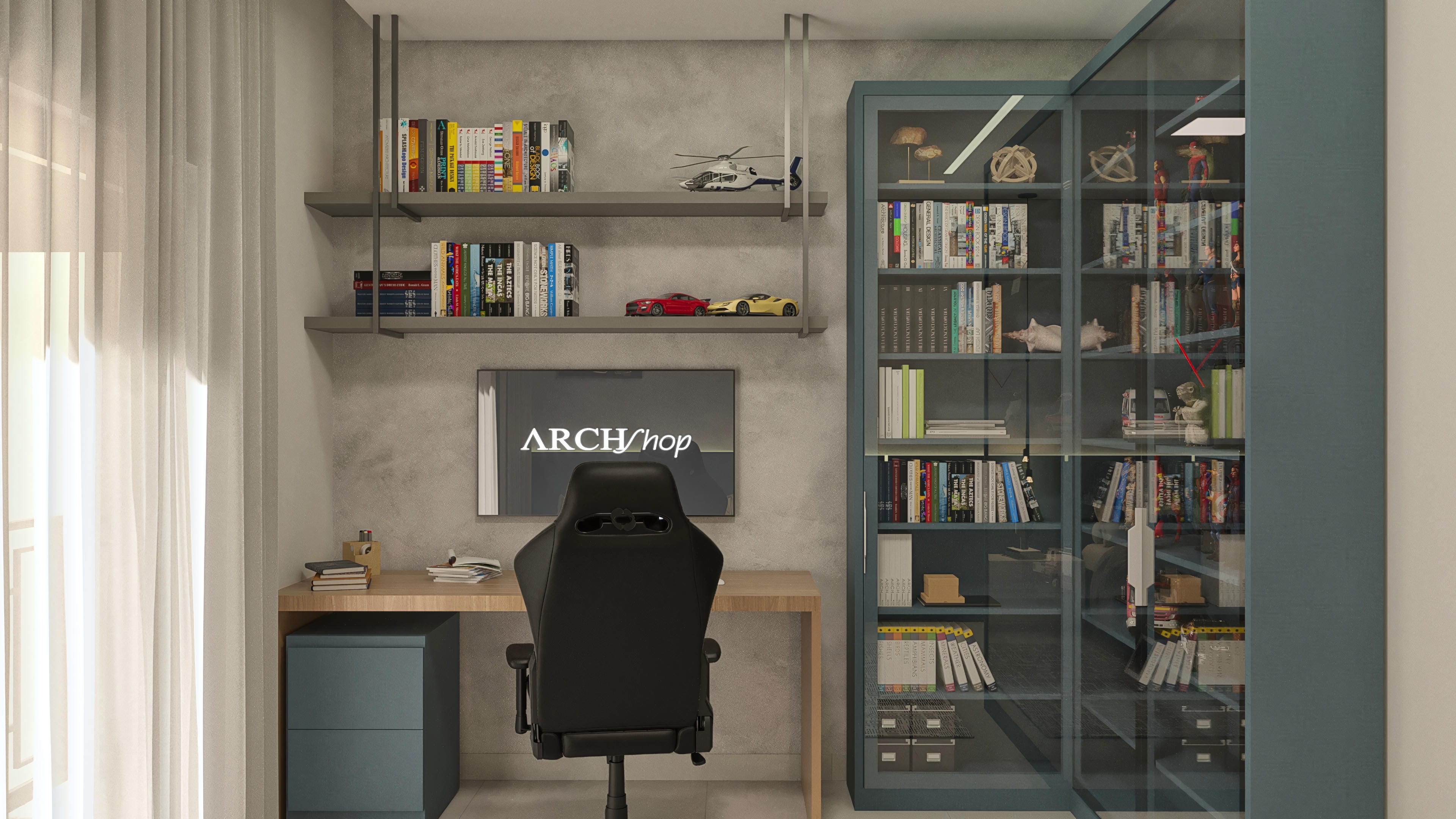 Office interior with a light wood desk, black gamer chair, shelves in gray and petroleum blue with books and decorative objects.