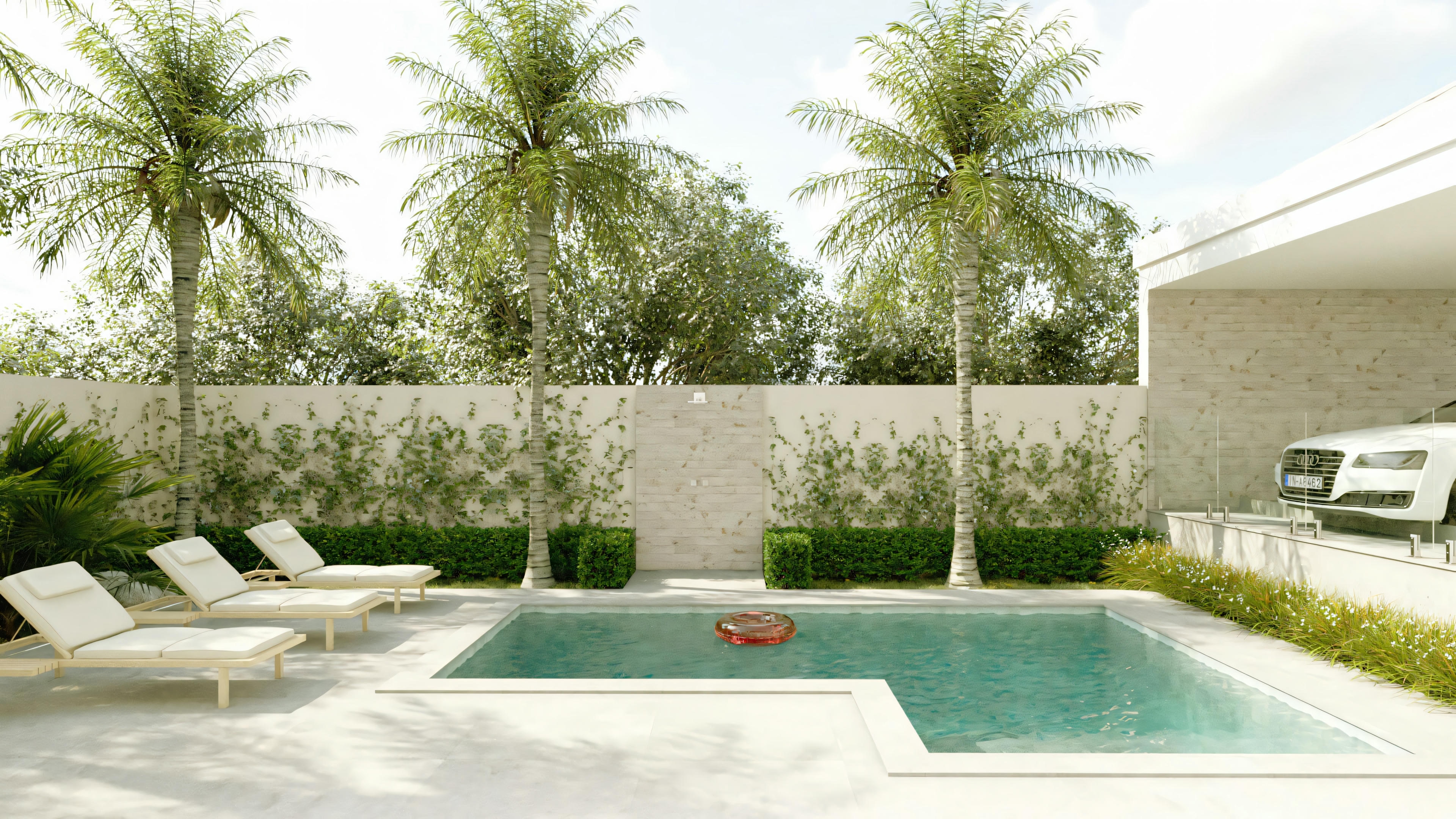 Una zona exterior con piscina, tumbonas junto a la piscina y árboles al fondo.