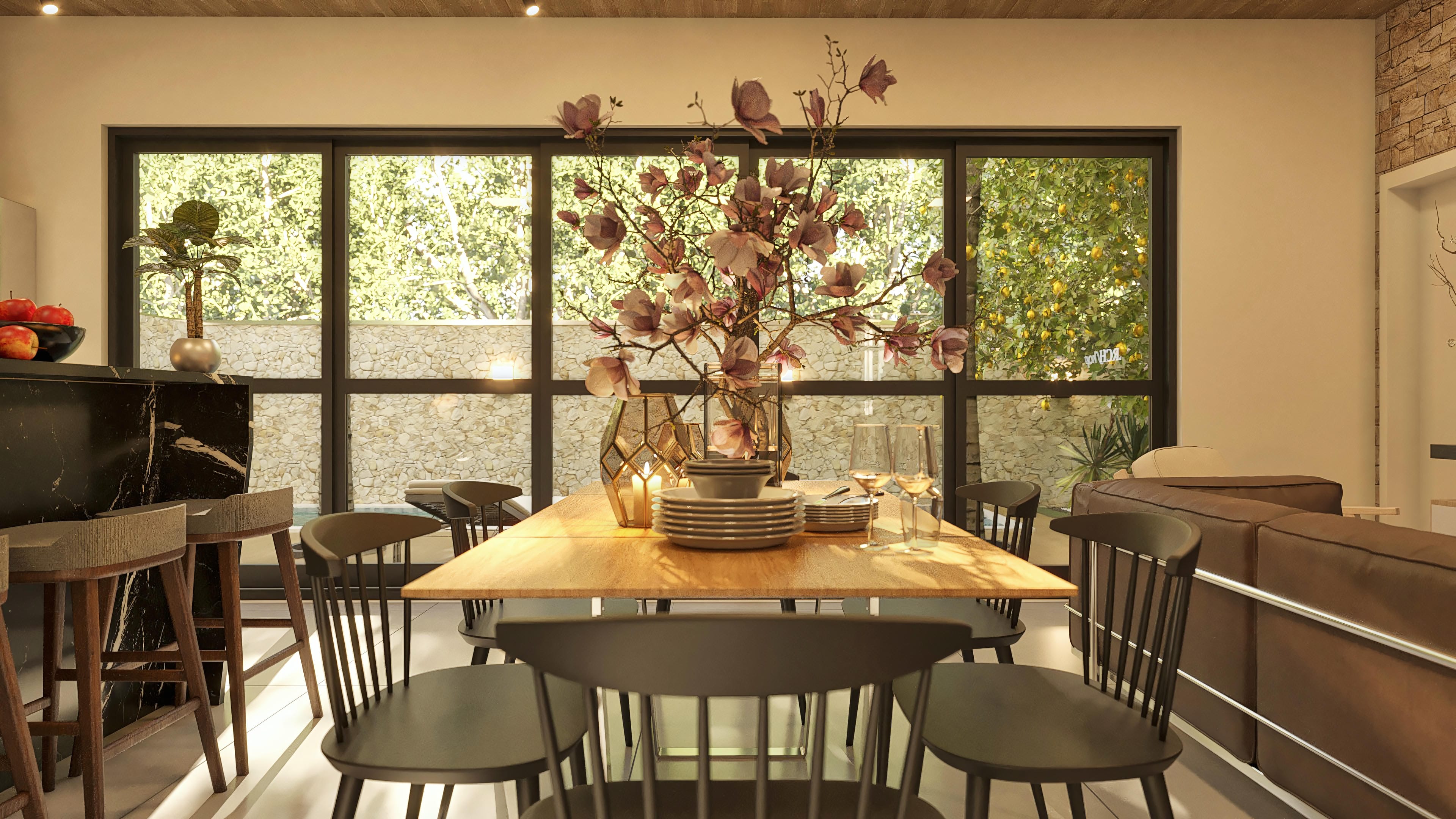 House interior with wooden dining table, black chairs, dark marble counter, and wide windows overlooking the outdoor area with landscaping.