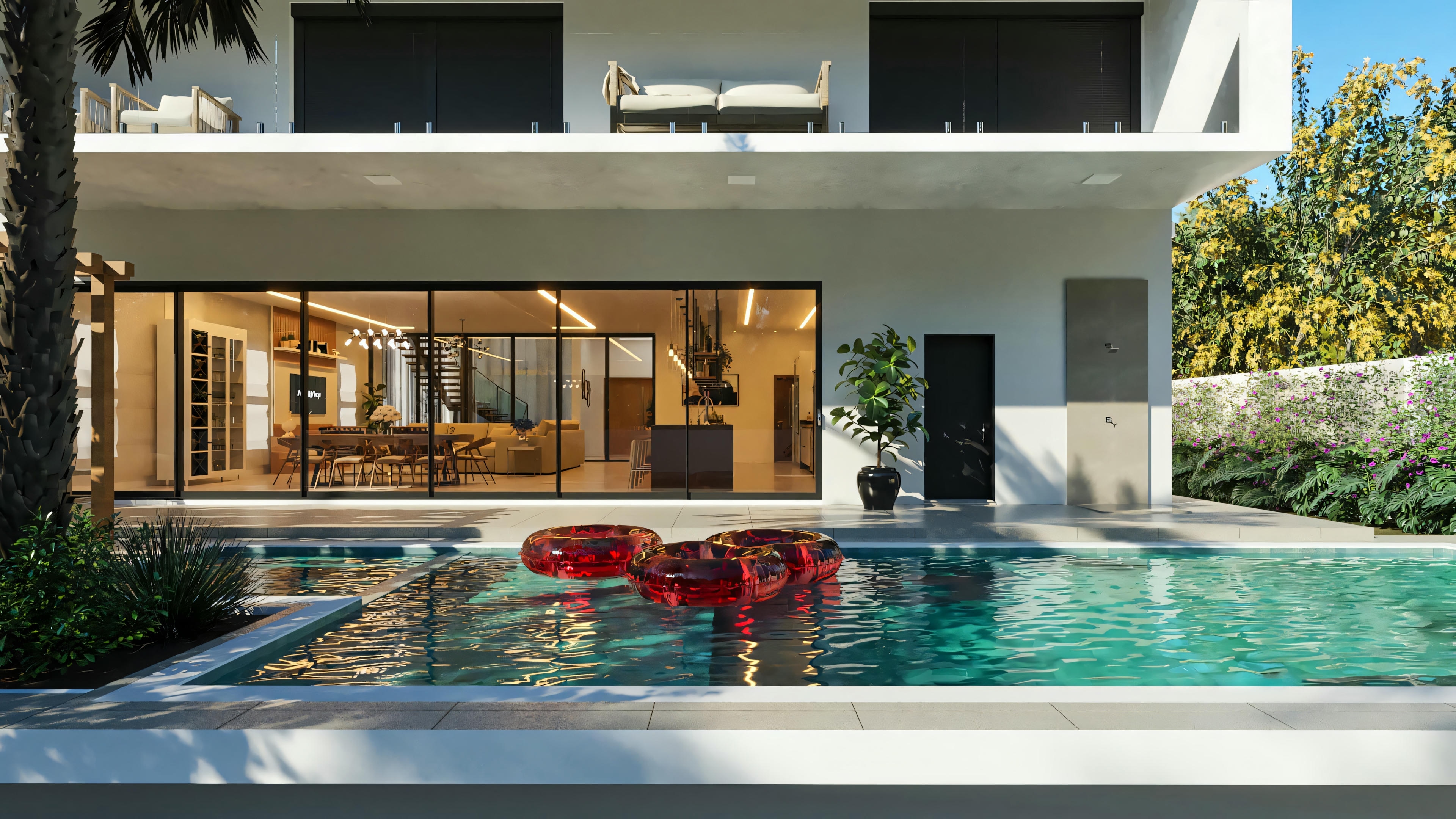 Fachada posterior de proyecto de casa moderna e imponente, mostrando integración del área social interna con la piscina a través de puertas de vidrio. Destaque para la piscina con deck, balcón superior con barandal de vidrio. Casa con 555.9m², 4 suites, área gourmet y 3 plazas de garaje.
