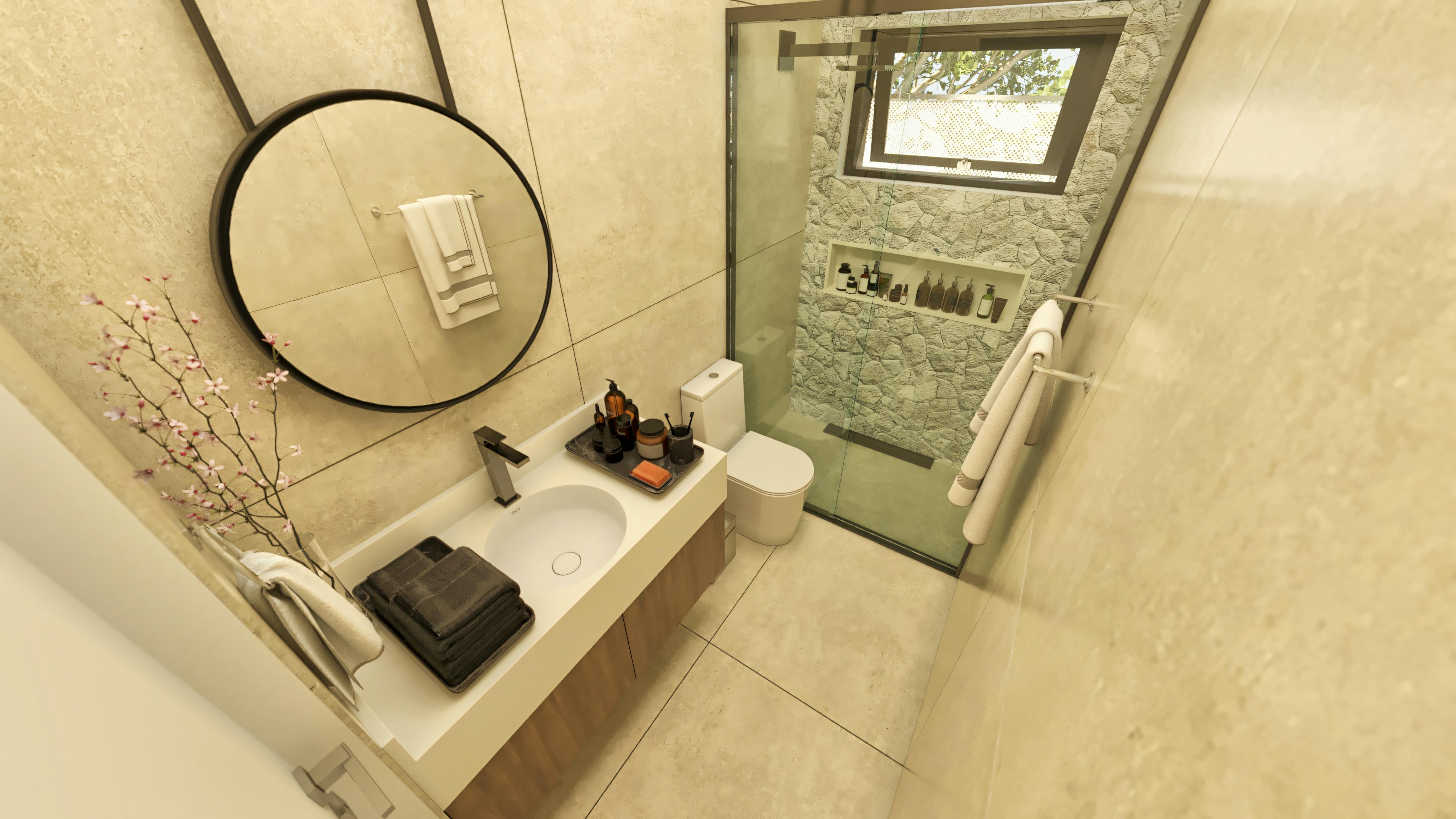 Baño con mampara de cristal y revestimiento beige.