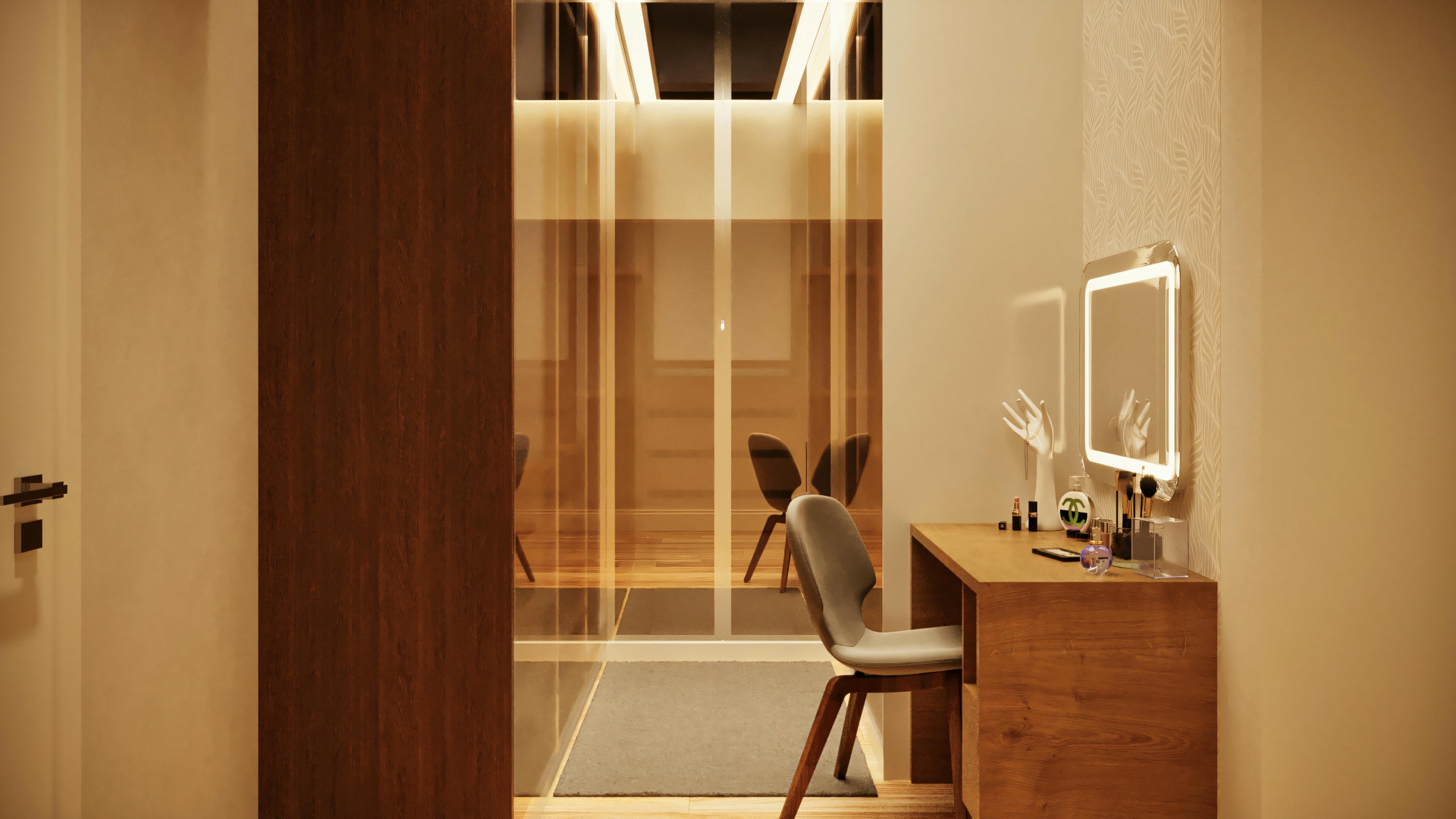 Área de vestir da suíte master em casa térrea com 3 suítes, mostrando penteadeira com espelho iluminado, armários em madeira escura e entrada para closet com portas de vidro.