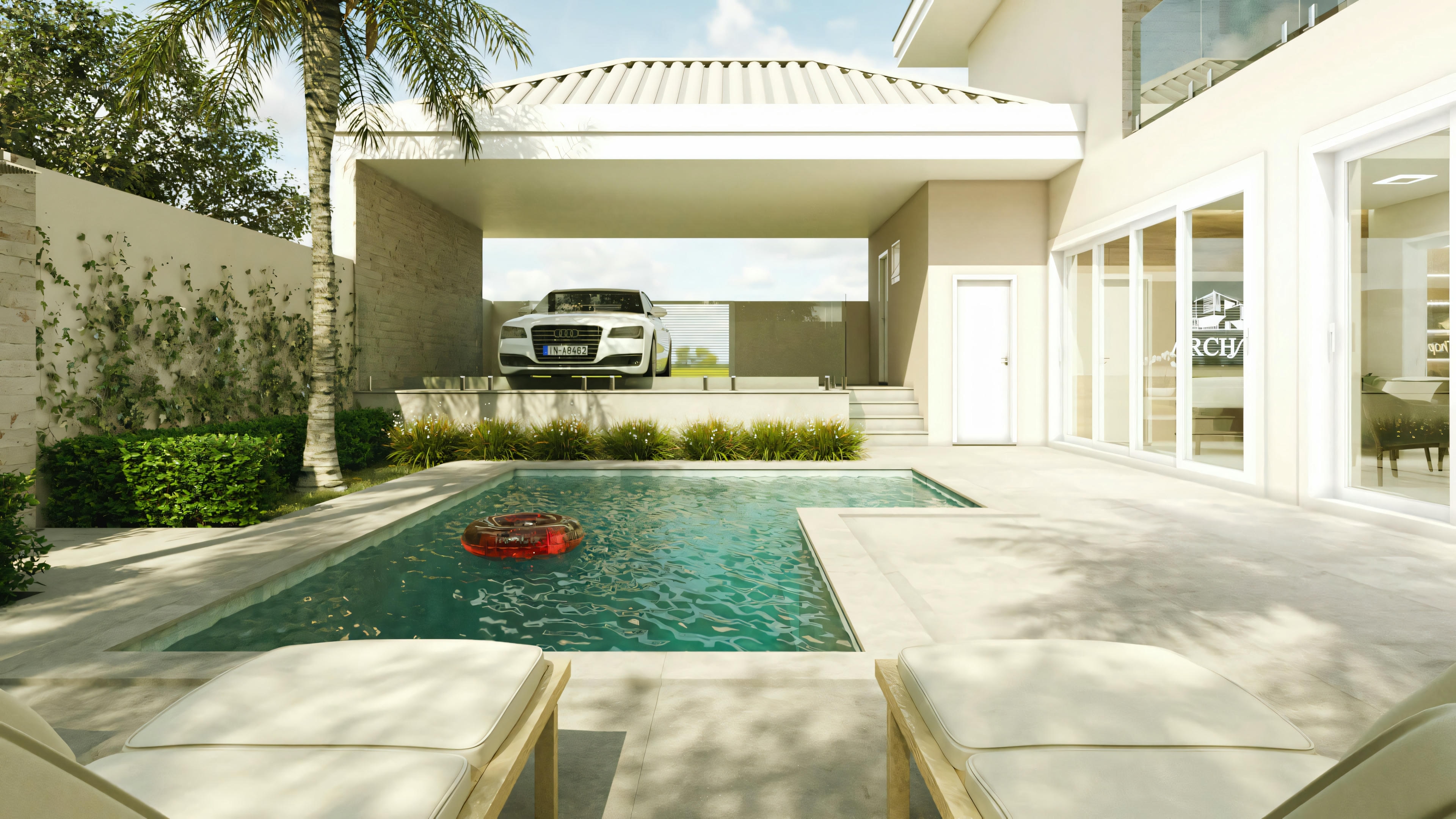 A luxurious pool area with a view of the house, with the pool along a path.