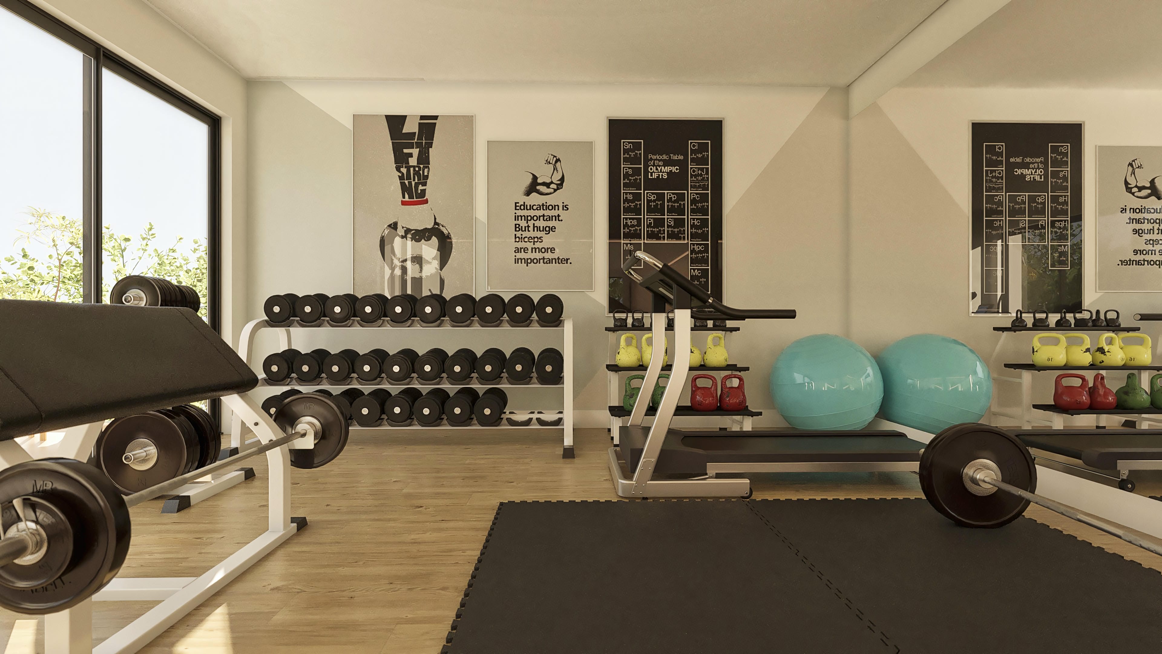 Gym interior environment with woody laminate floor, muscular equipment, weights, kettlebells, gymnastic balls, and inspirational paintings.