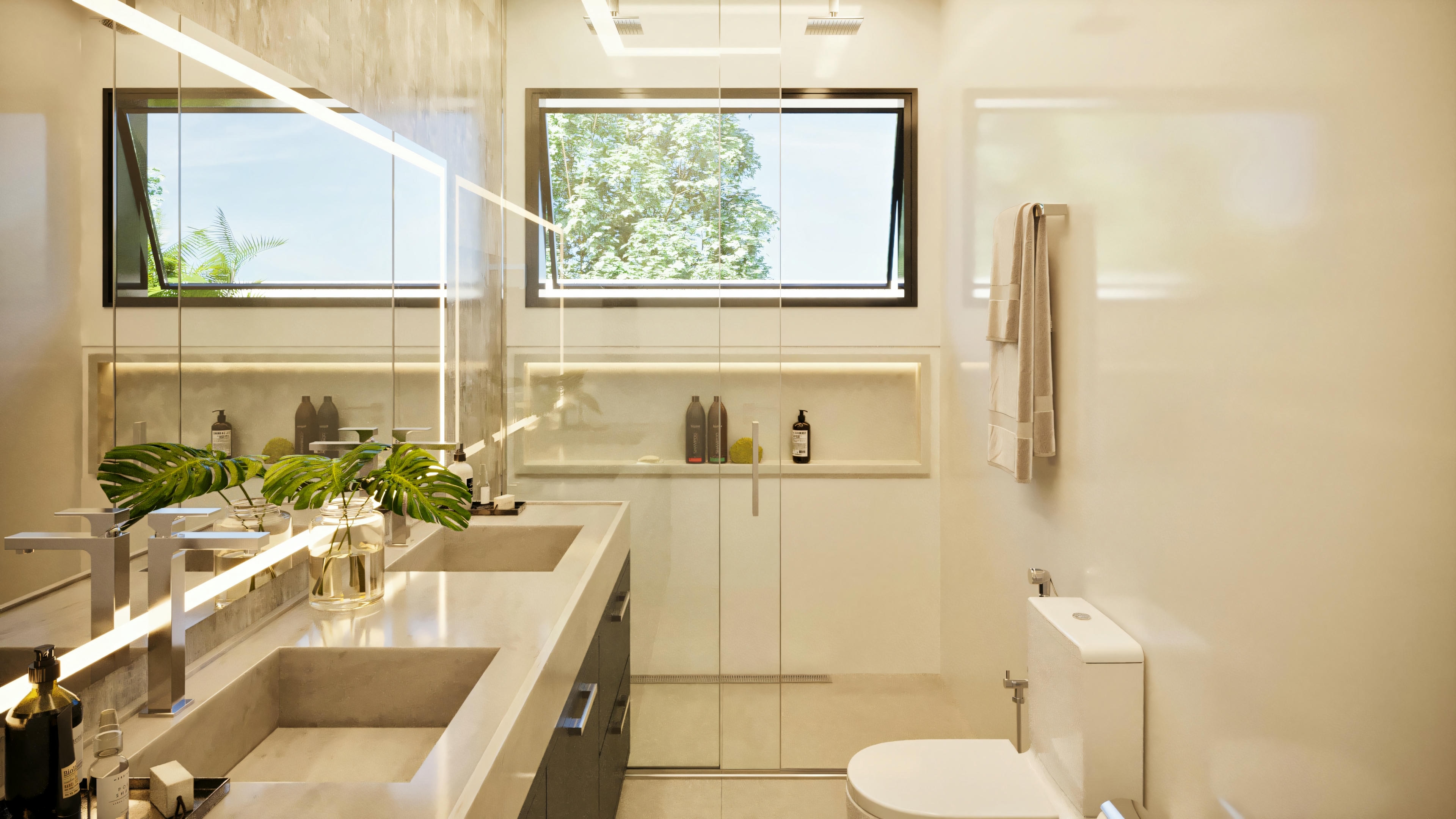 Baño principal de casa de planta baja con 3 suites, presentando encimera espaciosa con lavabo doble, espejo grande con iluminación LED, armarios inferiores, y box con nicho y ventana.