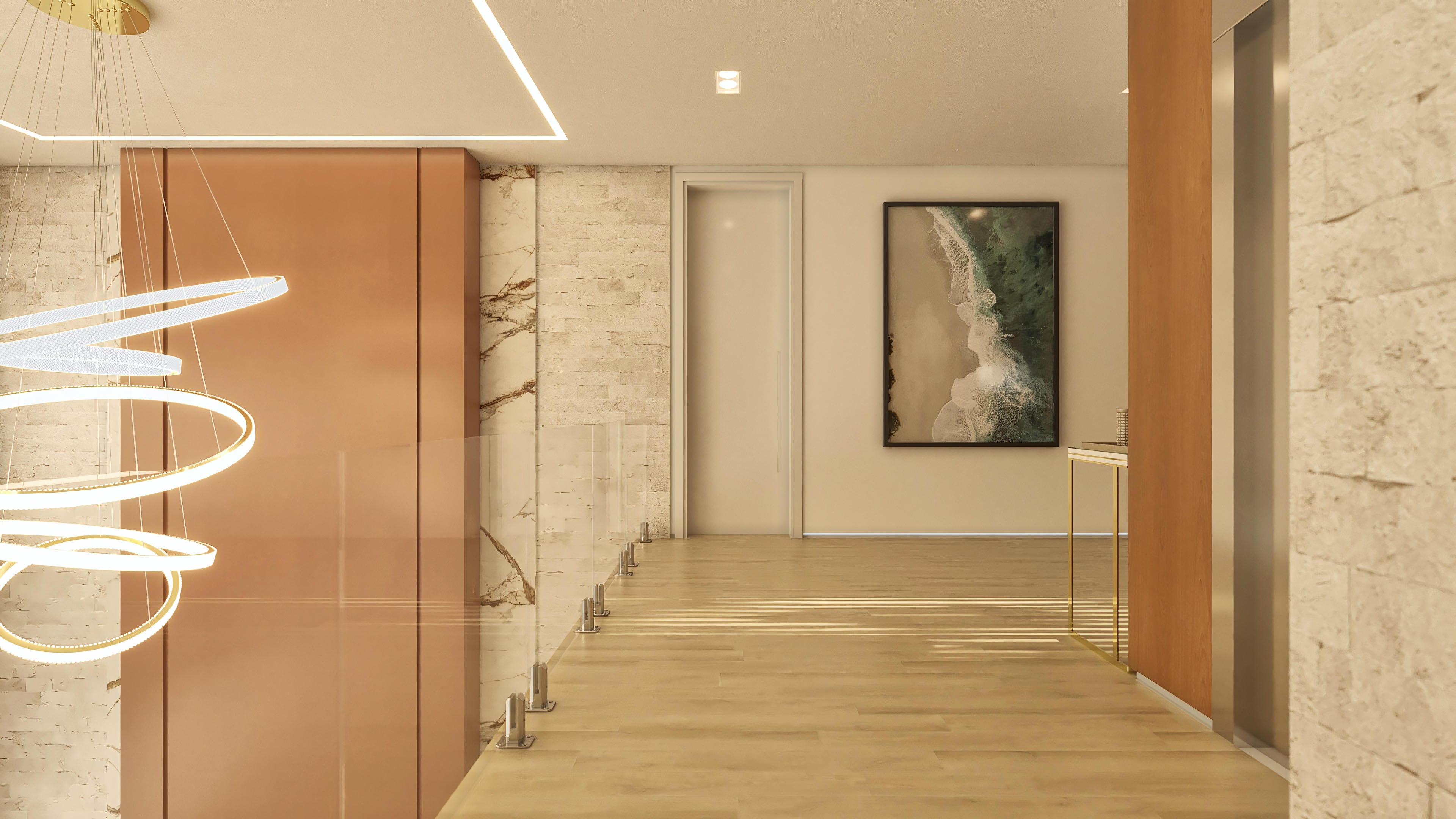Pasillo con suelo de madera clara, paredes en tonos beige con texturas de piedra y mármol, y ebanistería en tono cobre. Moderna lámpara de anillos suspendidos que ilumina el espacio.