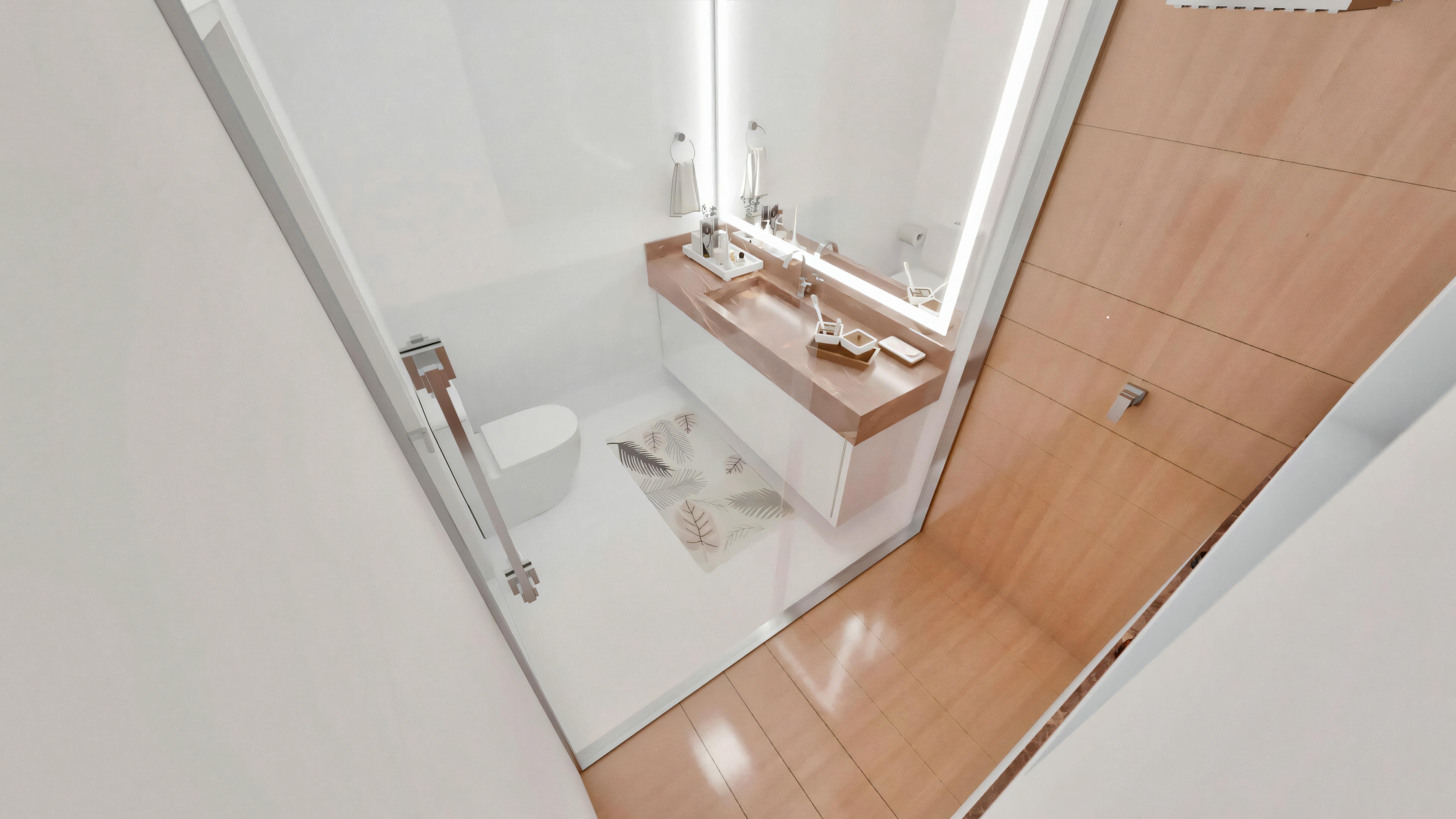 Top view of the bathroom of one of the 5 suites in the ready-made project, with a light wood countertop and door, illuminated built-in mirror, white toilet, glass shower enclosure, and white interior flooring.