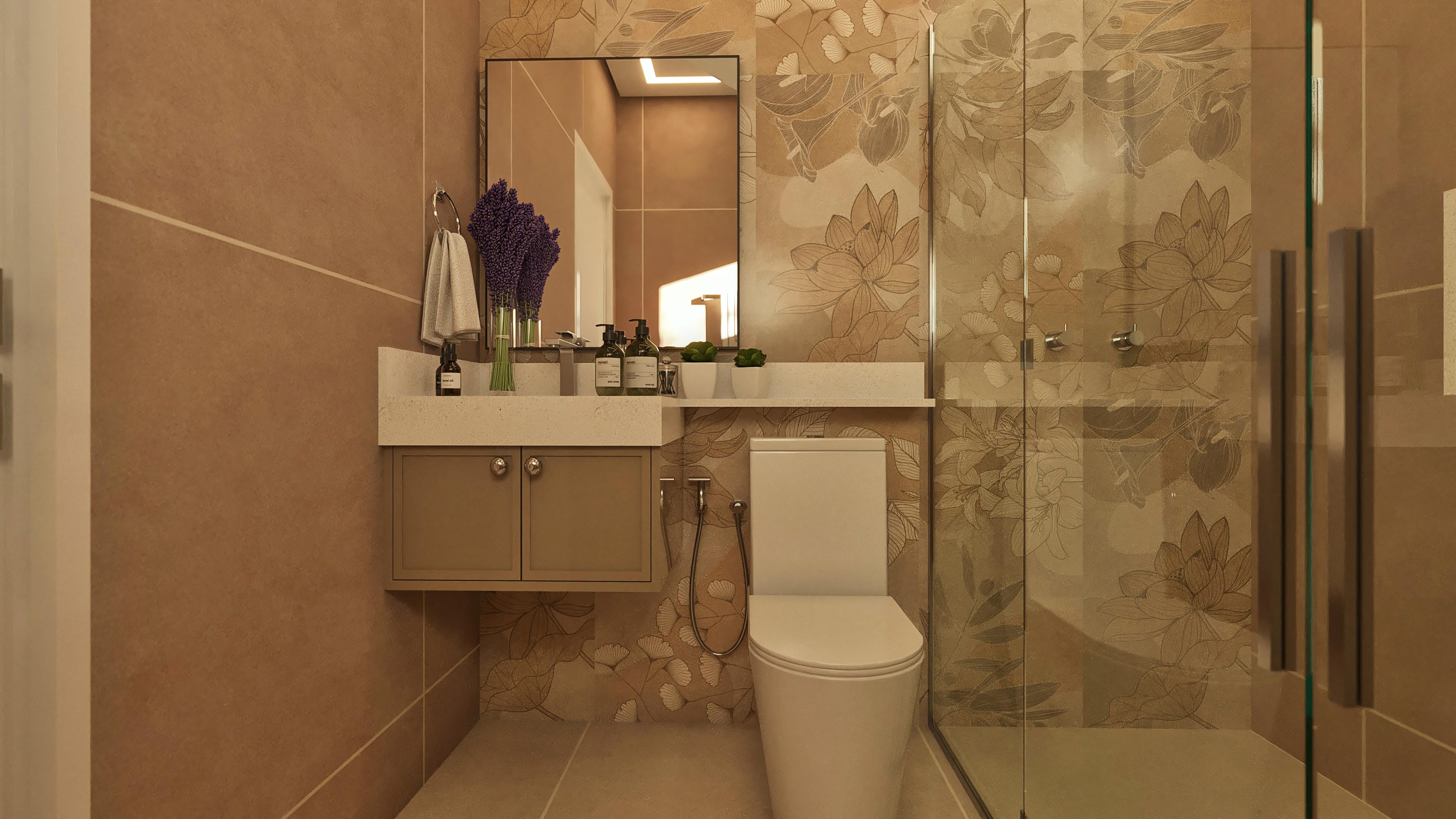 Detalle de baño moderno con revestimiento cerámico en tonos tierra y estampado floral discreto. Lavabo esculpido, espejo amplio y box de vidrio confieren sofisticación.