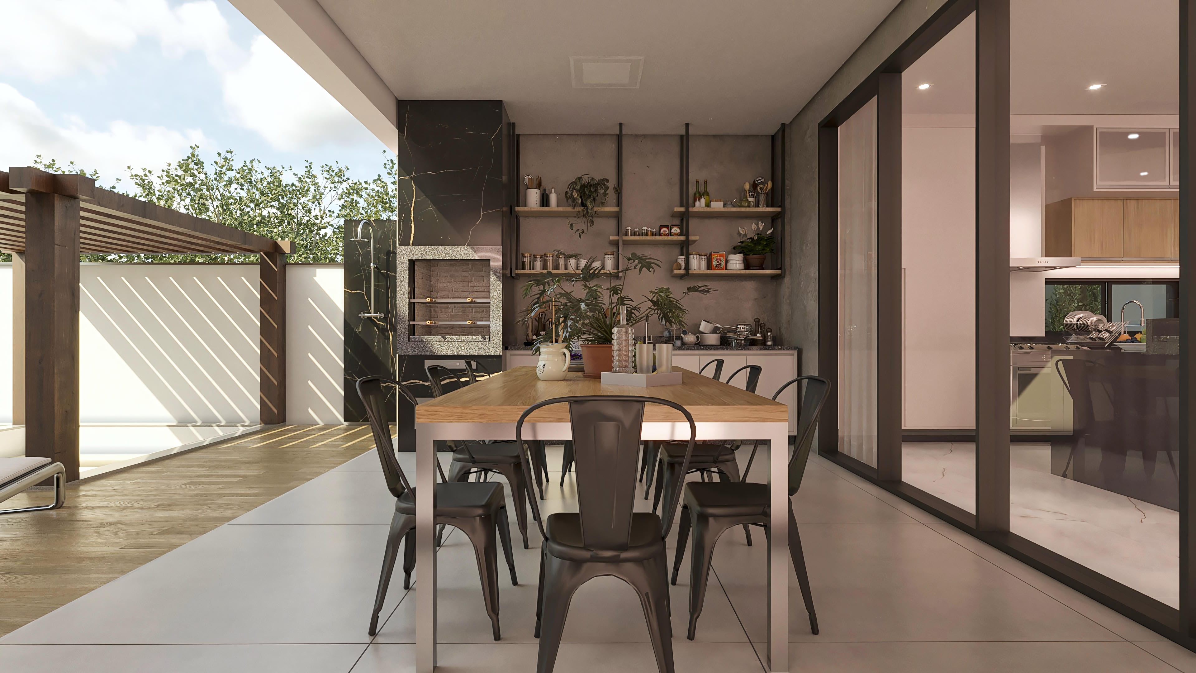 Gourmet area of a modern two-story house with barbecue grill, dining table, integrated kitchen, and pool. Marble and burnt cement claddings.