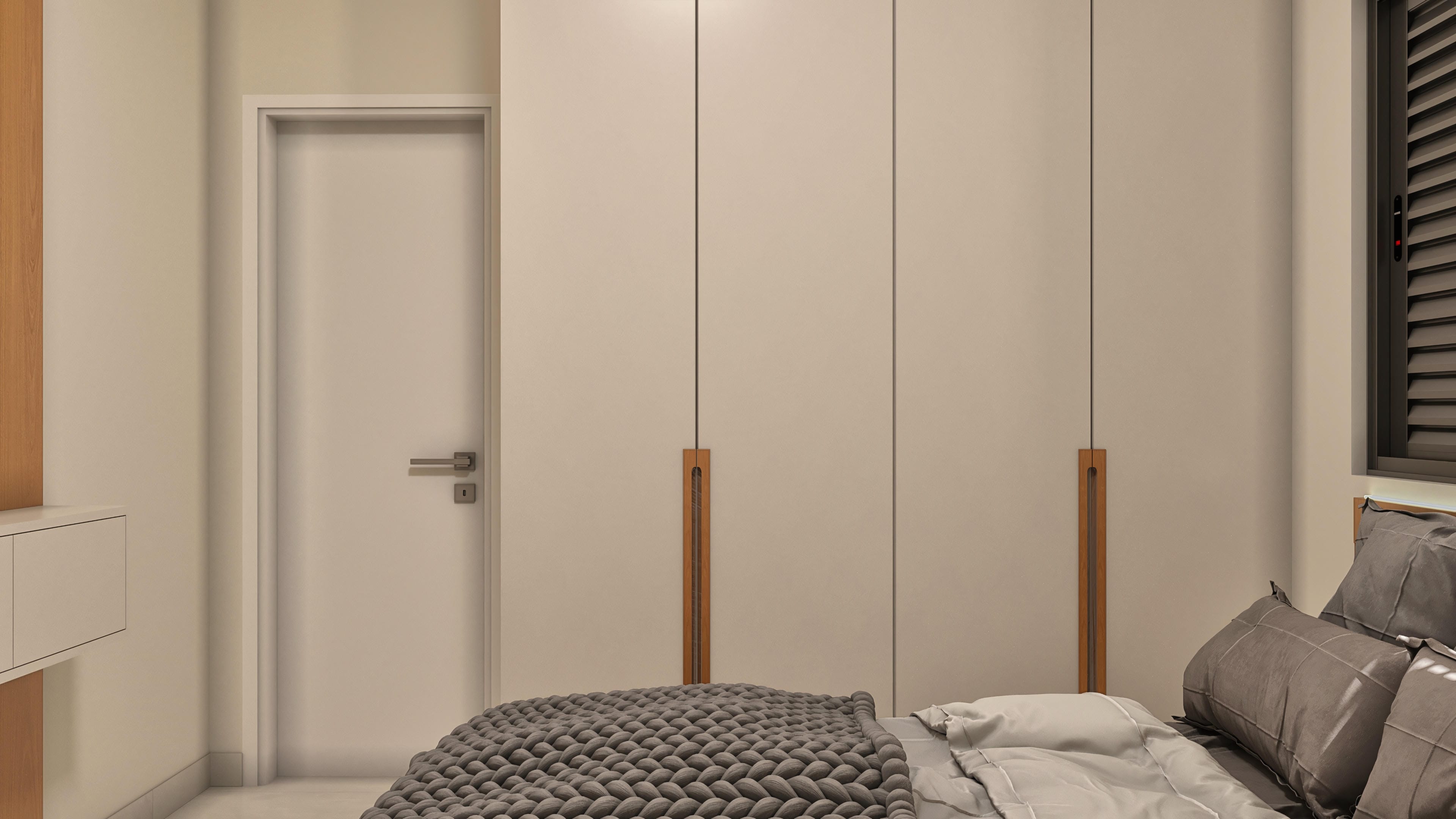 Built-in wardrobe with smooth panel doors and vertical wood handles, complemented by a white hinged door with modern hardware.
