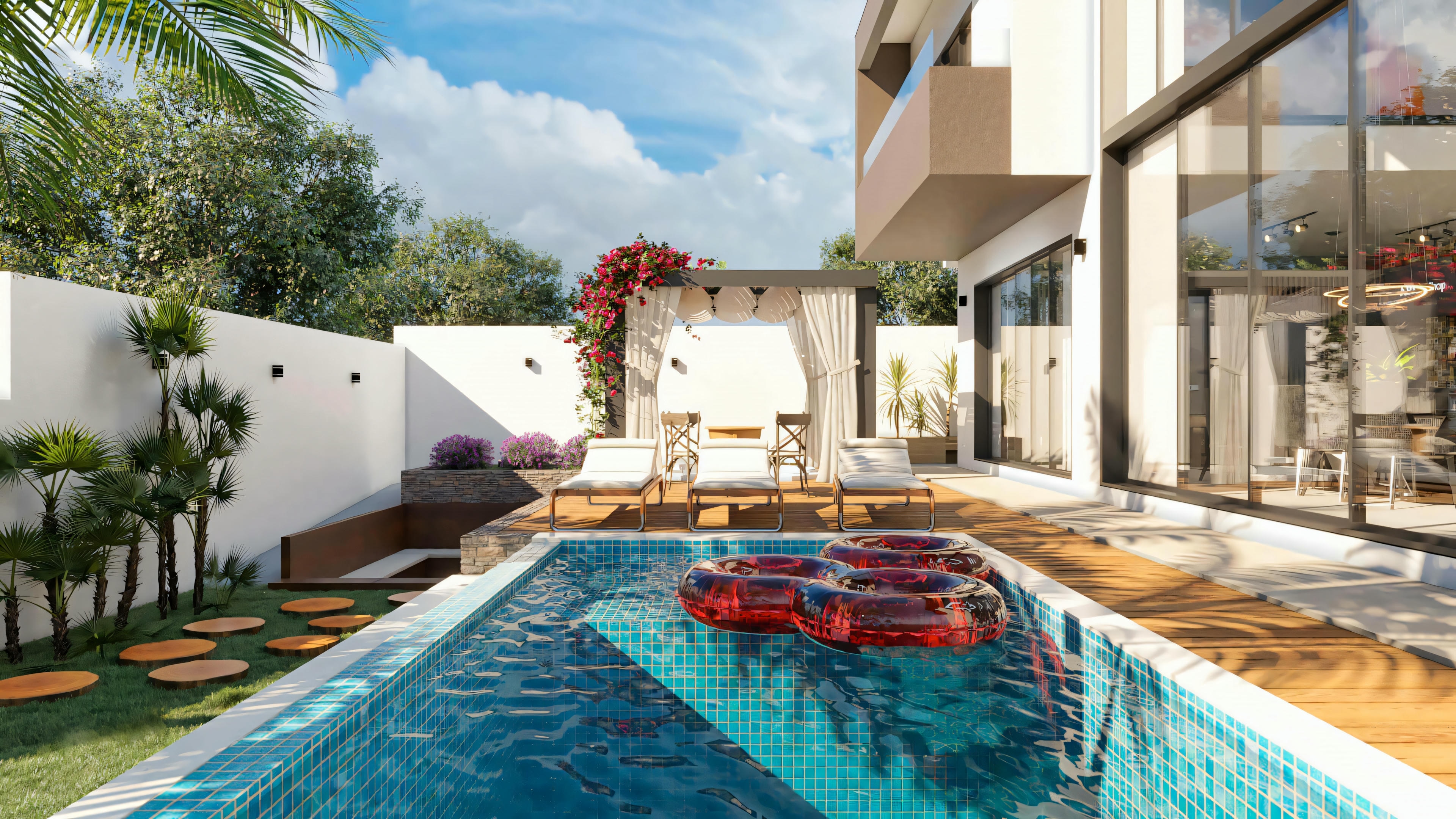Wide view of the leisure area of the ready-made house project with 5 suites, showing the pool with a wooden deck, side garden with pathway stones, and covered rest area (pergola) in the background.