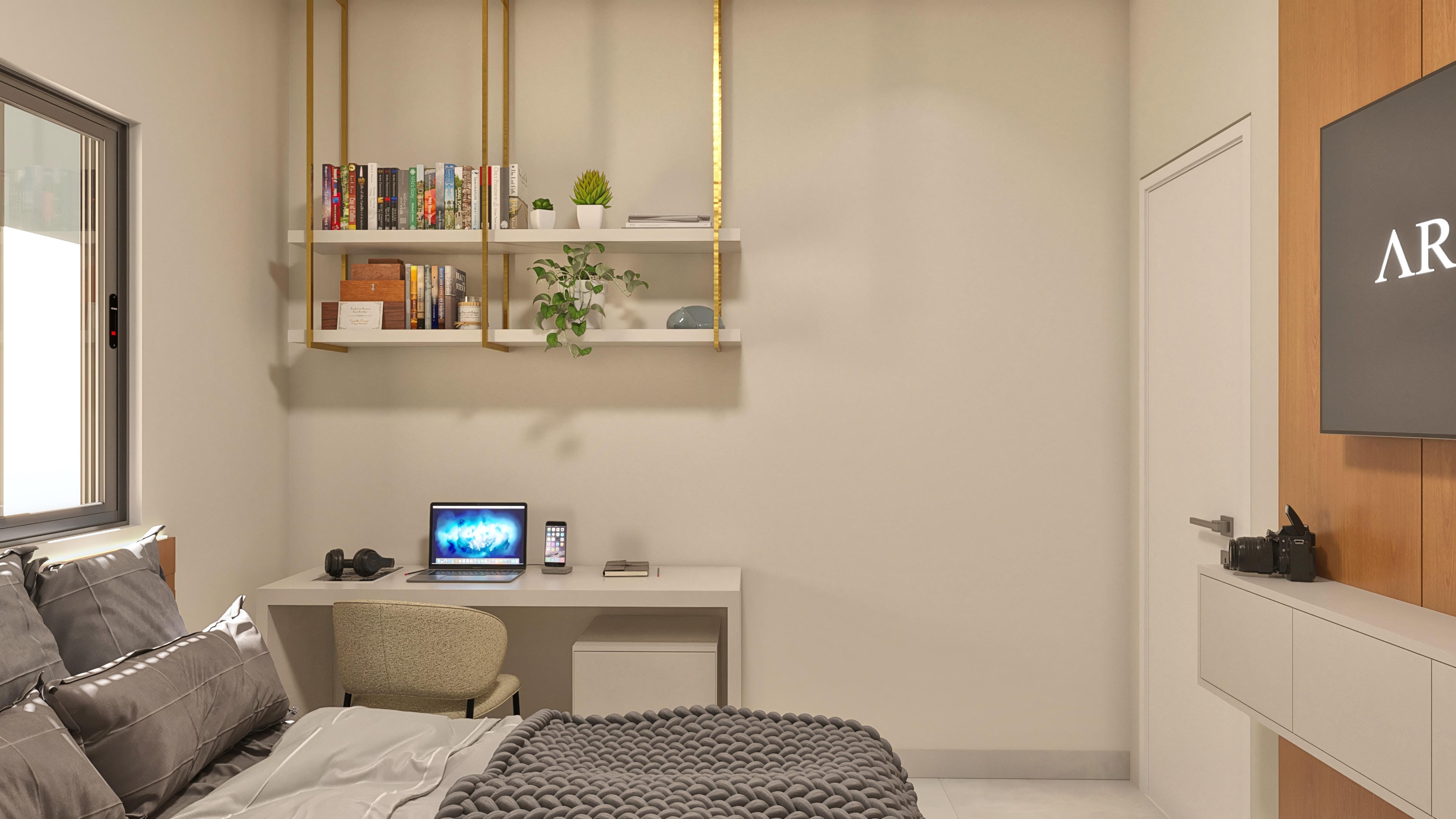 Interior of a modern office with a large window, golden shelves with books and plants, a desk with a laptop and cell phone, and a bed with textured bedding.