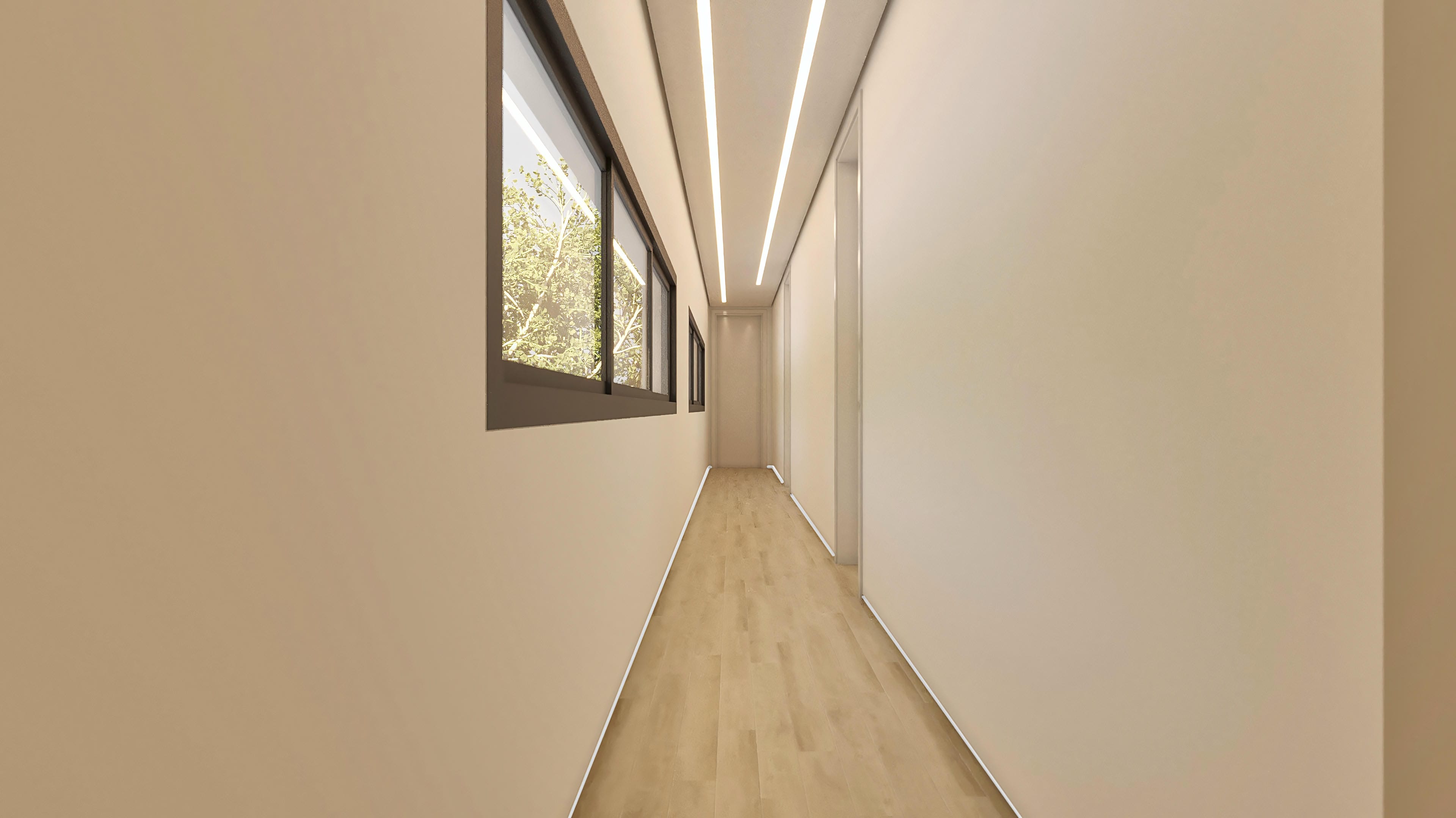 Pasillo interior con paredes claras, suelo de madera clara e iluminación lineal en el techo, con grandes ventanas que revelan la vegetación exterior.