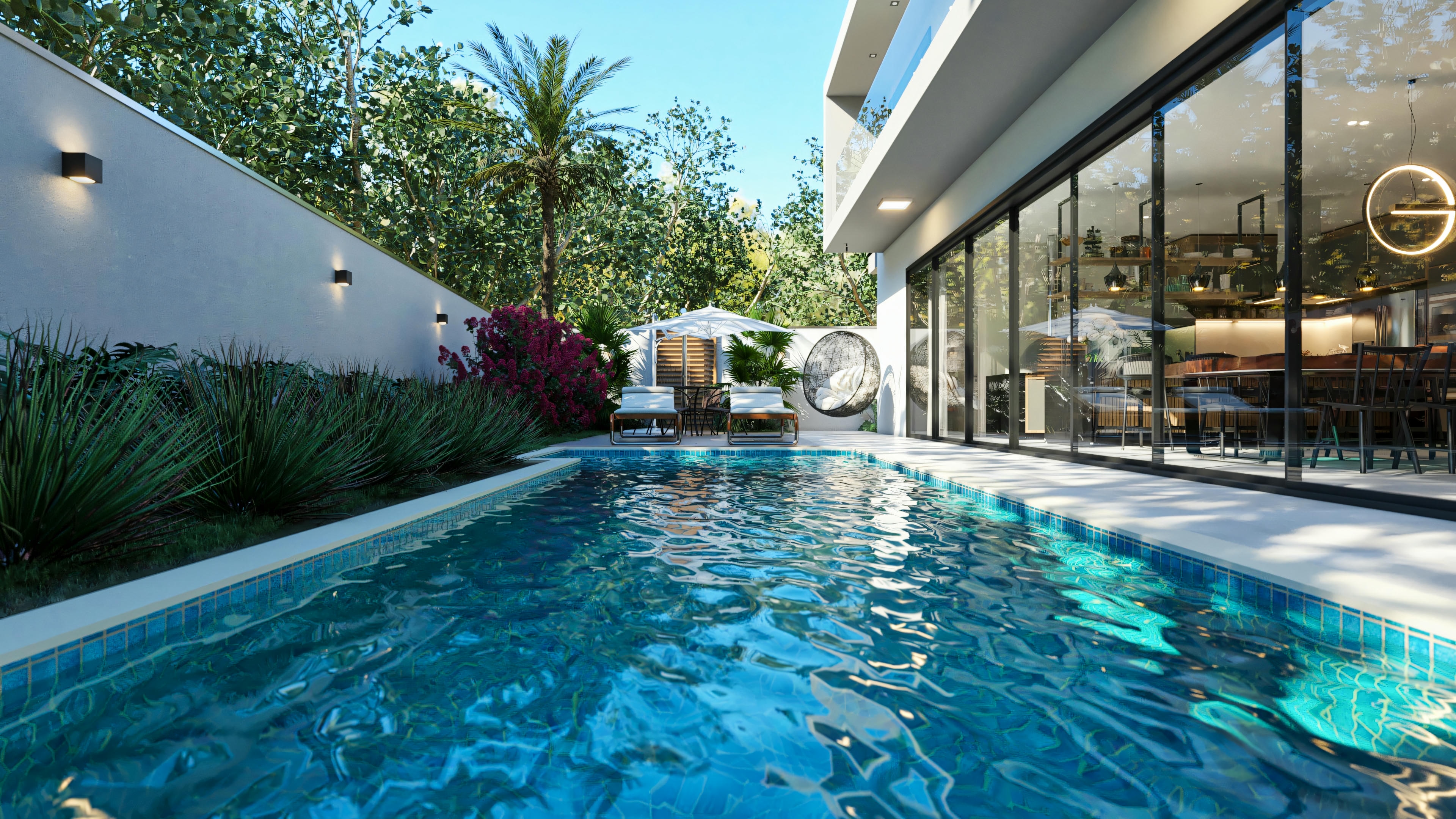 Área de lazer com piscina da casa de alto padrão com 5 suítes, integrada à área gourmet e social da casa por portas de vidro. Deck com espreguiçadeiras, poltrona suspensa e paisagismo completam o ambiente.