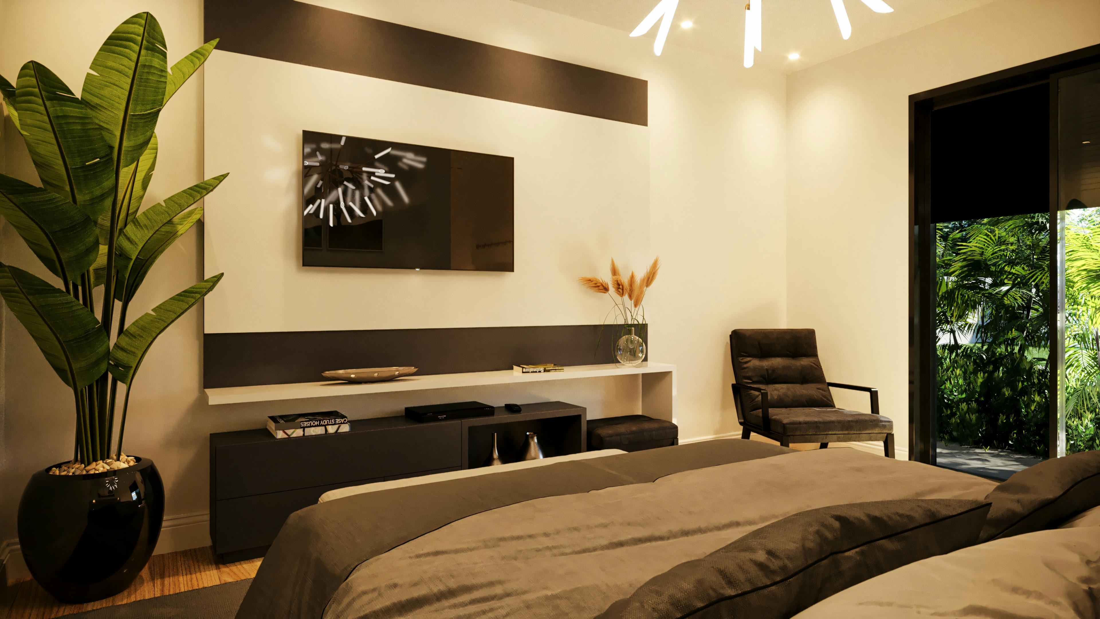 Vista de la cama de la suite principal en casa de planta baja con 3 suites, mostrando panel de TV, butaca, y grandes puertas de vidrio con acceso a la zona externa y vista al jardín.