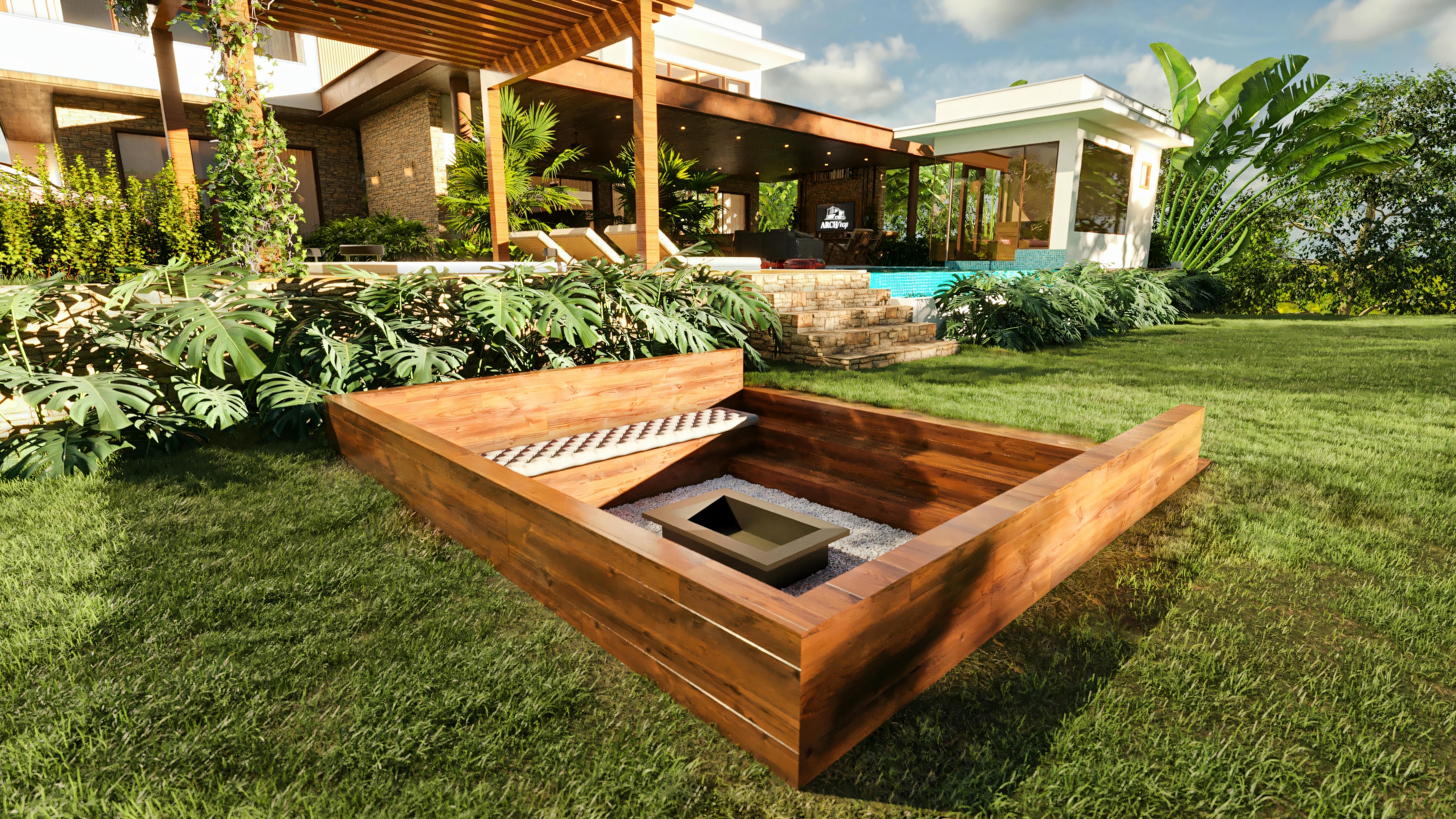 Fire pit rebaixado com estrutura de madeira e assentos embutidos, localizado no jardim de uma casa de luxo, com a piscina, área gourmet e outras estruturas da residência visíveis ao fundo.