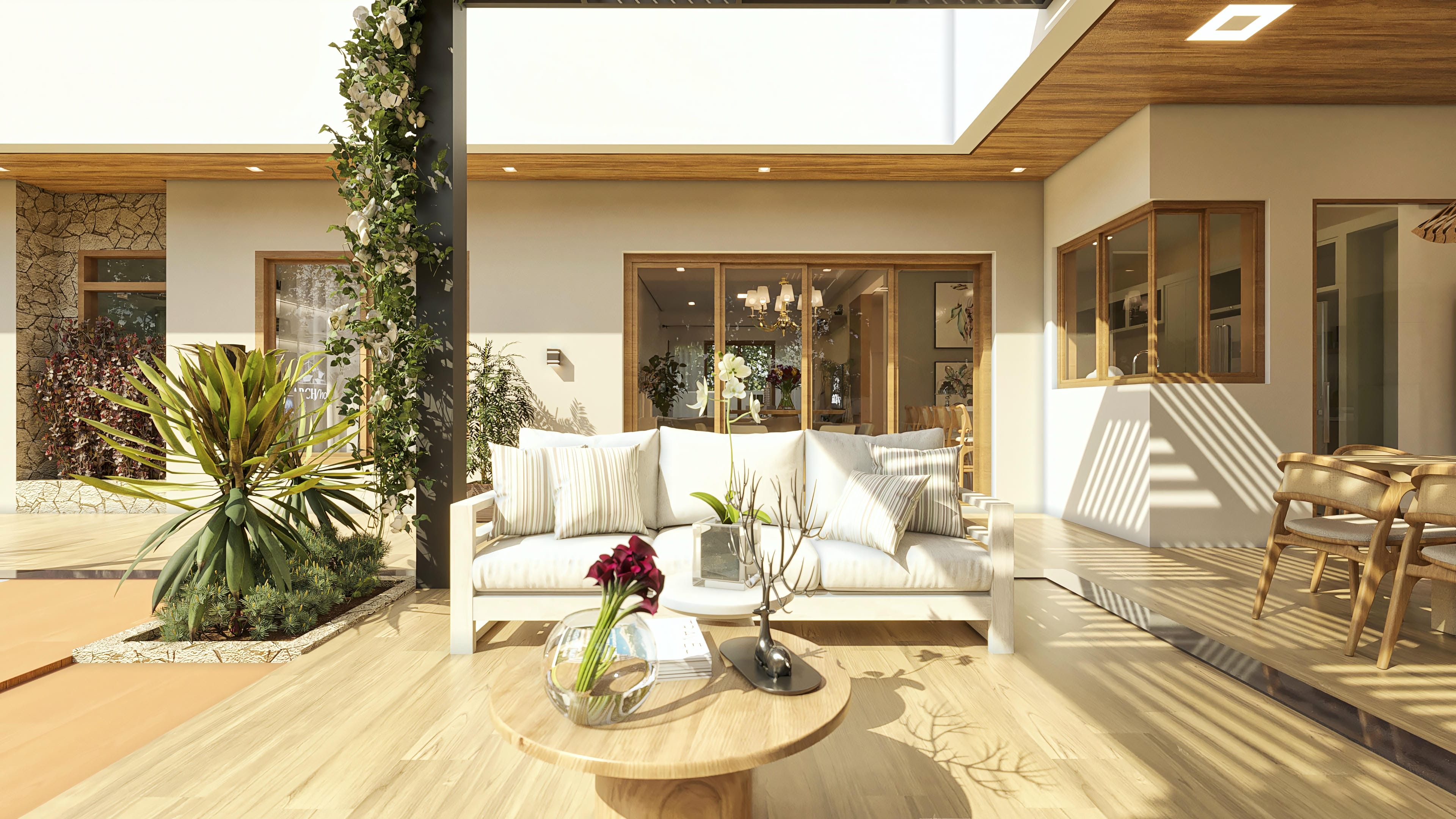 Espacio de convivencia moderno con sofá blanco, mesa de centro, sillas de madera, deck de madera, vegetación exuberante y área de piscina.