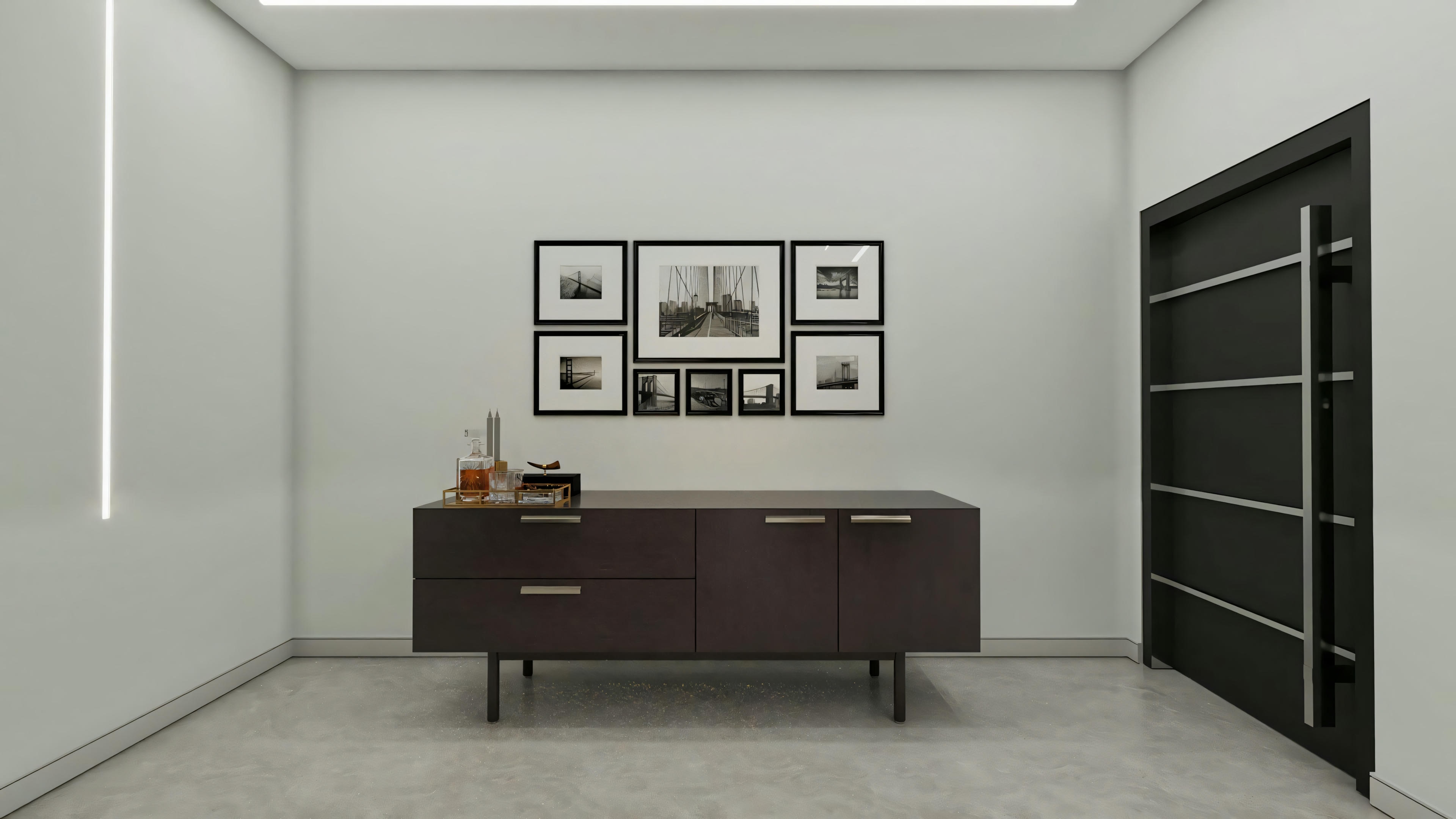 Modern design entrance hall, featuring a dark sideboard, set of black and white pictures, dark door with vertical handle, and recessed LED lighting in the wall and ceiling, interior of a luxury residential project.