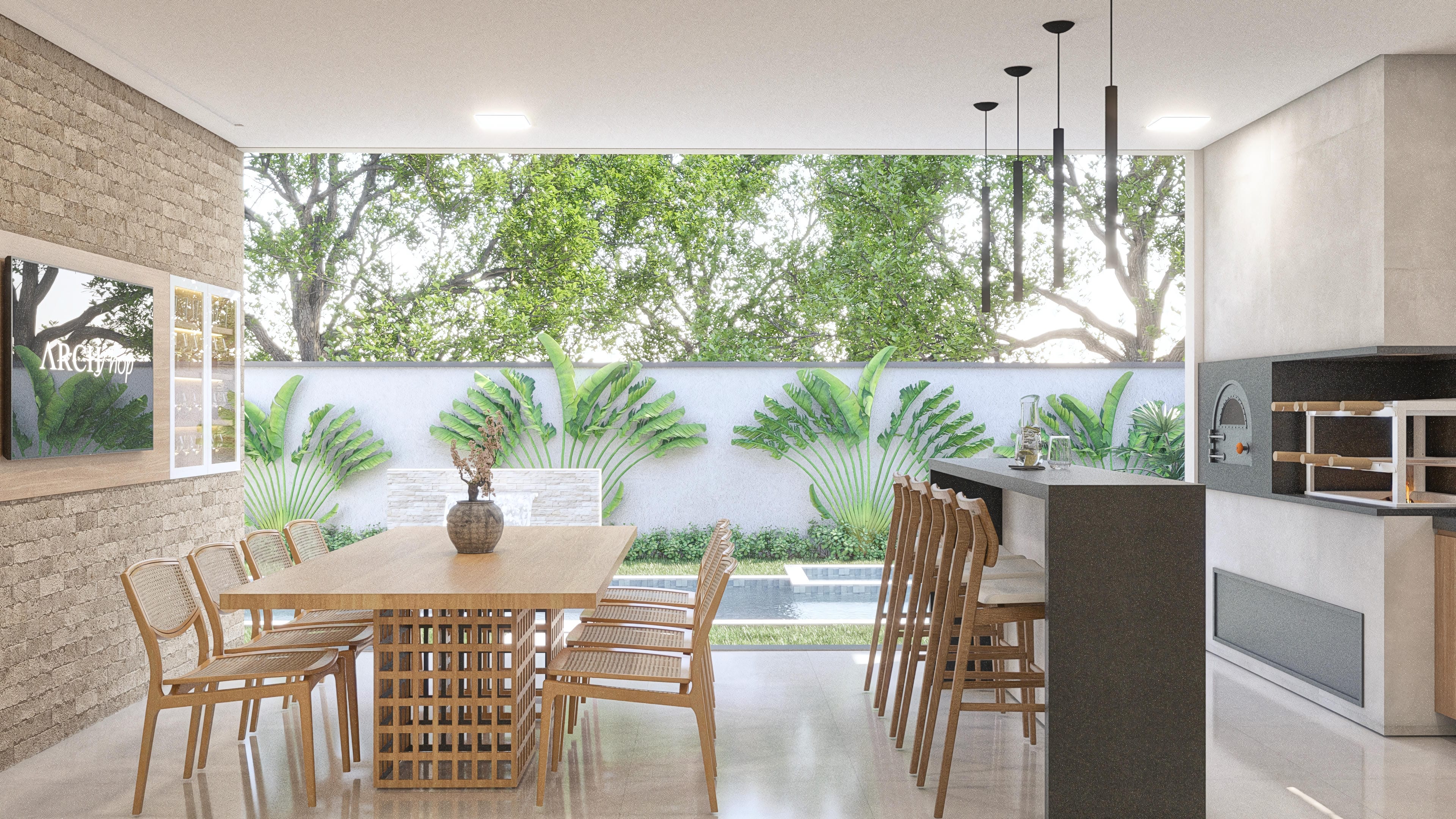 Gourmet area with a barbecue grill, countertop, and a view to the pool and lush garden. Detail of the dining table with wooden chairs.