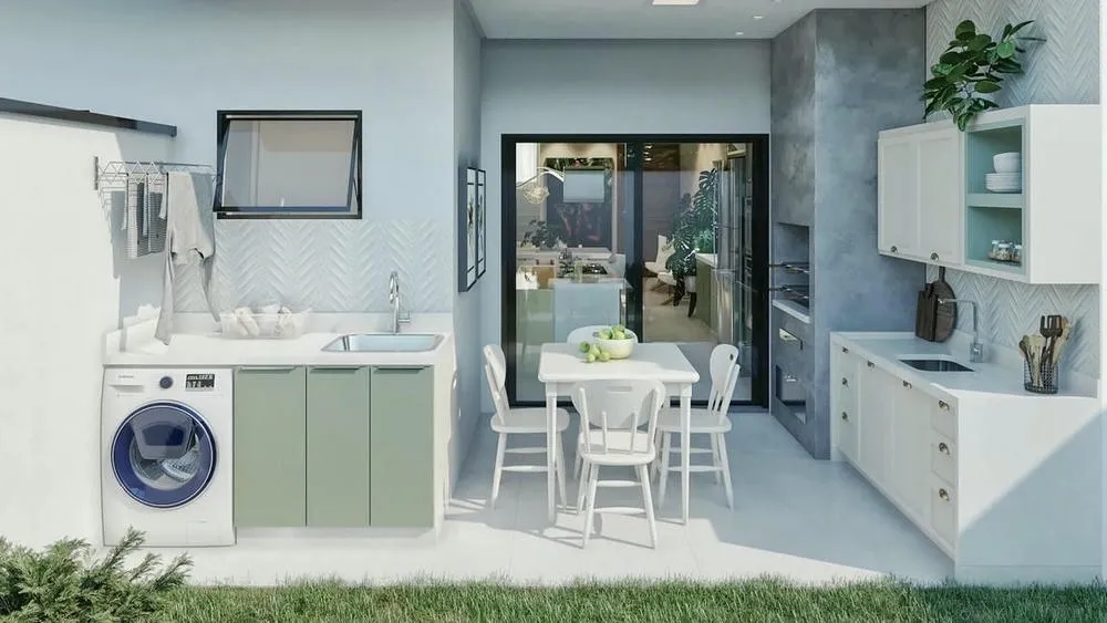 Lavandería externa funcional con lavadora, fregadero y armarios, con una mesa de comedor al lado.