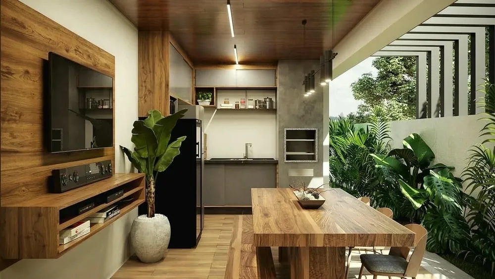 Área exterior con tonos neutros, madera y vegetación, reflejando la paleta de colores del estilo industrial en un ambiente de convivencia.