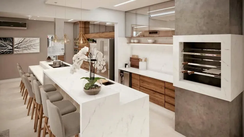 Área gourmet funcional e integrada com design moderno e iluminação que valoriza o ambiente.
