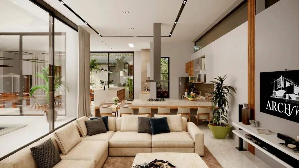 Amplia área social de casa de alto standing, integrando sala de estar, comedor y cocina, con grandes aberturas al exterior.