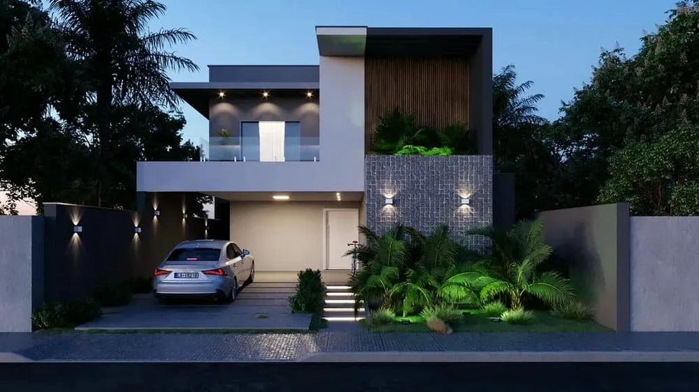 Proyecto de casa de dos pisos con doble altura y revestimientos rústicos, destacando la imponencia y el diseño contemporáneo.