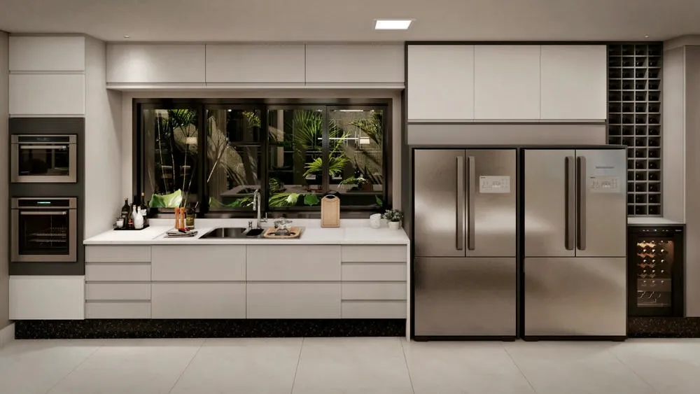 Cocina planificada con armarios que se extienden hasta el techo, maximizando el espacio de almacenamiento en el Proyecto Caribe.