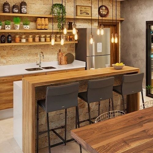 Modern gourmet area with wooden counter, shelves with spices, and pendant lighting, ready for use.