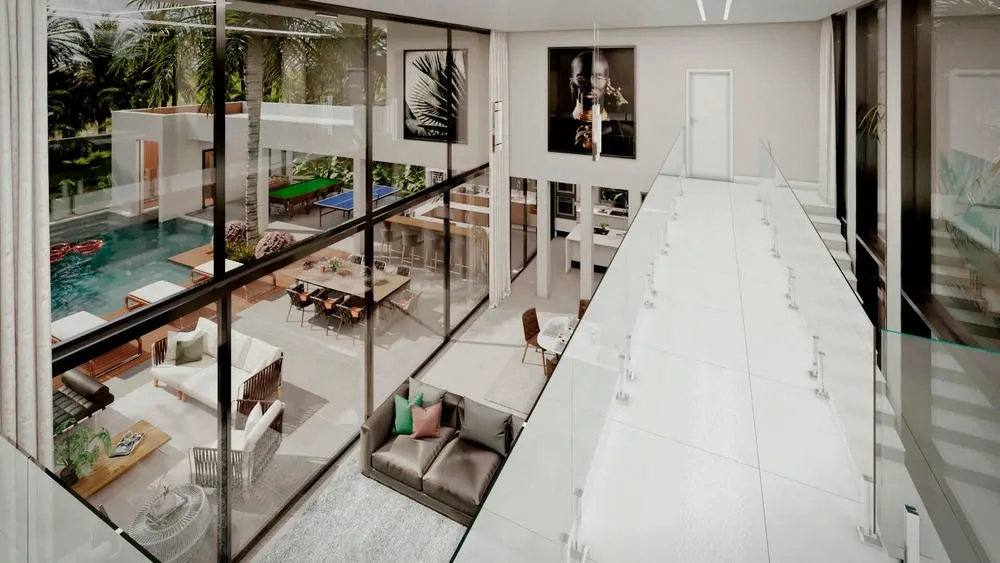 Grandes janelas e portas de vidro integrando o interior da casa com o exterior, ampliando o conceito aberto e a iluminação natural.