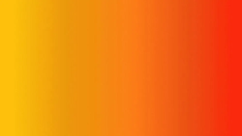 Fundo abstrato em tons vibrantes de vermelho, laranja e amarelo, ilustrando as cores quentes e sua intensidade.