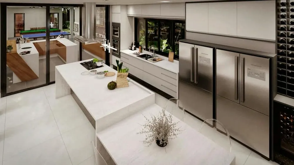Cozinha moderna e espaçosa em sobrado de alto padrão, com bancada em ilha, eletrodomésticos embutidos e integração com área externa de lazer.