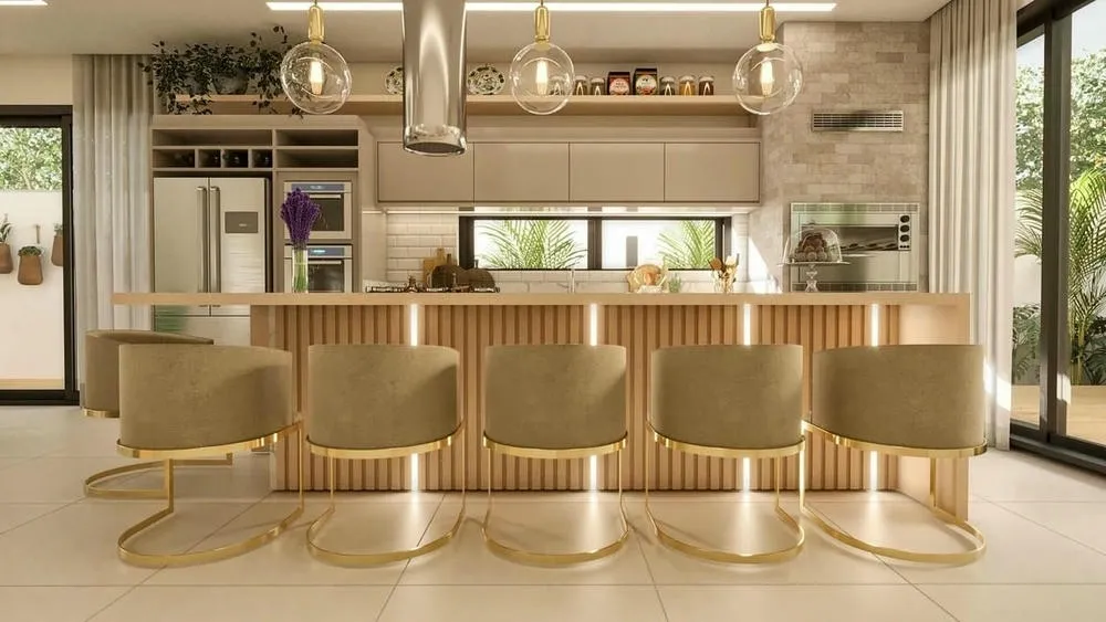 Detalhe da ilha de cozinha com bancada e espaço para refeições rápidas, com luminárias pendentes.