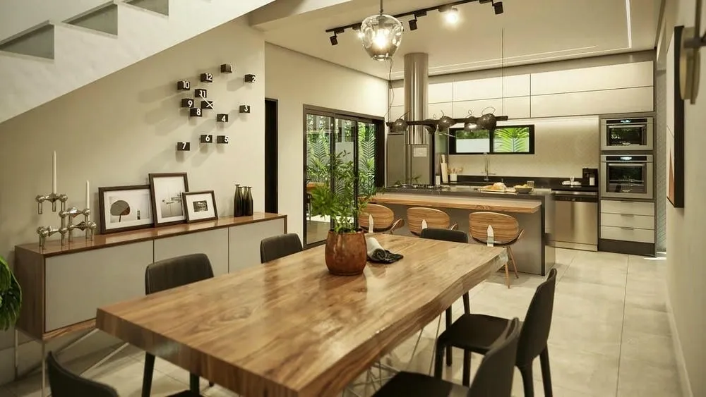 Ambiente interno com parede de tijolos expostos e elementos industriais, como tubulações aparentes e luminárias de metal.