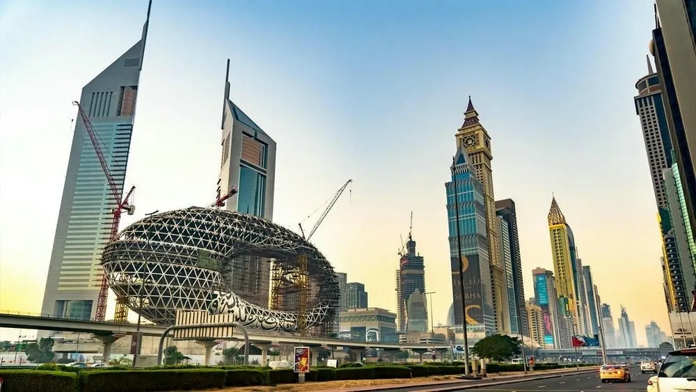 Modern skyscrapers in Dubai, United Arab Emirates, with a futuristic design building in the foreground.