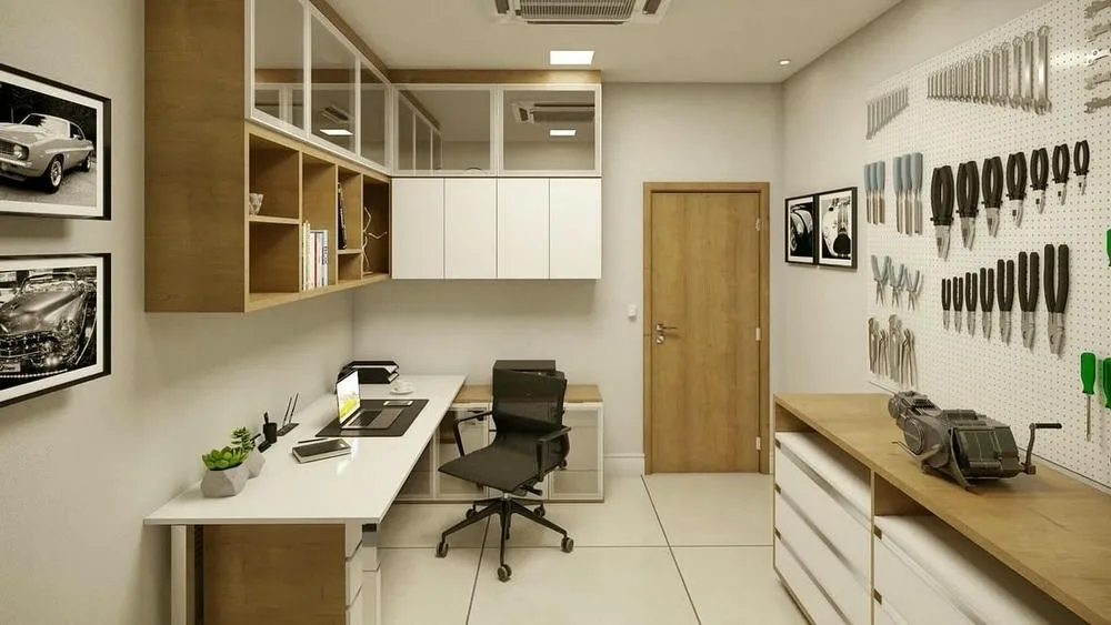 Home office with custom-made furniture, workspace with computer and a workbench with tools, adapted to the user's needs.